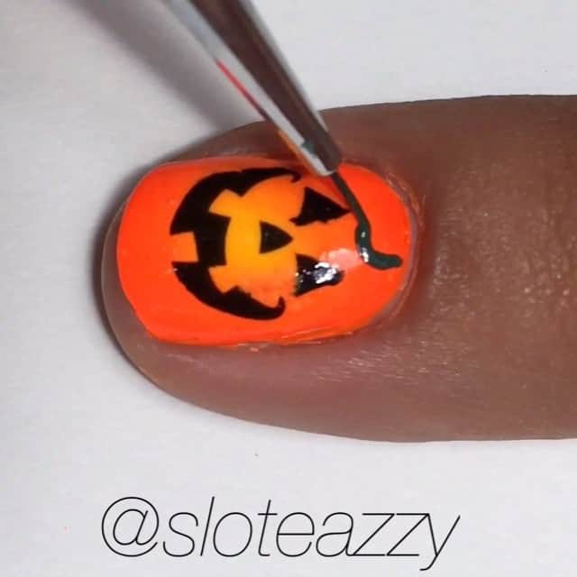 Yasmeenのインスタグラム：「🎃Polishes used: @nailnation3000 White, @virtuouspolish Chastity (yellow) & Diligence (orange), All topped with Wet n Wild Matte Topcoat. Pumpkin face decals from @shopkeeki , green vines made with acrylic paint and my JN Dance 24 brush from @stylishnailartshop . 💜 Purple stuff around my finger is Liquid Palisade, made and sold by @kiesque . Step 1️⃣ Paint your nail white and let dry completely! (I apply a fast drying topcoat to assure my base dries thoroughly) 2️⃣ Apply Liquid Palisade around finger 3️⃣ Paint colors onto sponge as desired 4️⃣Sponge onto nail 5️⃣ Repeat steps 3&4 as needed 6️⃣ Remove Liquid Palisade 7️⃣Cut out decal and place in water for a few seconds 8️⃣Slide decal off backing & place on nail 9️⃣ Draw vines 🔟 Topcoat & you're done! **SONG 🎵 The Citizens of Halloween- This Is Halloween #nailsbysloteazzy #sloteazzytutorials」