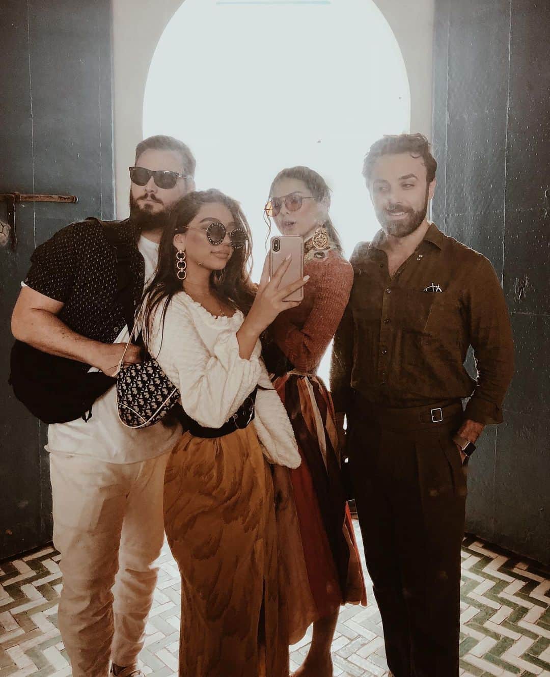 JANICE JOOSTEMAさんのインスタグラム写真 - (JANICE JOOSTEMAInstagram)「Memories from Morocco 🇲🇦 This was one of the most memorable and fun trips.. even though James and I were so ill because we went straight from Coachella to Morocco and everyone at Coachella got sick because we were all sharing so many drinks and partying too hard.  But Marrakech definitely holds a special place in my heart, so grateful to have made such an amazing trip like that happen with @doina and @danielpdykes.  The first night was magical, we went to a hidden restaurant in a creepy alley way and as the door opened, it was so lively. There were women in beautiful outfits dancing, the food was phenomenal. We walked through rose fields and had tea parties on the grass laying on layers of blankets and pillows. We drove 6 hours away through the Atlas Mountains which was terrifying as the roads were so thin and you could barely see 10 feet in front of you to see where they filmed Game of Thrones and I fell in love with a baby goat. I fell in a muddy river. We stayed in the most beautiful Moroccan home courtesy of our friend and ate the most delicious food every meal. We saw so much beautiful art and became pros at going to the souk market. We stayed at beautiful hotels in between. We watched Game of Thrones and drank wine while it rained loudly outside. We spent the night in a Glam tent with plumbing in the middle of nowhere and we drank so much and danced the night away to the point I was throwing up and had to get on a camel at 7am which was worth it. We then had a beautiful lunch overlooking rolling hills and watched a clever camel get out and run away. We spent nights staying in and hanging out near the pool in our garden just talking, dancing and laughing. I feel so grateful to have so many beautiful memories with James and so many of our friends. I can’t wait to make more 😭💕💕💕 #thankstotravel」4月15日 4時47分 - janicejoostemaa