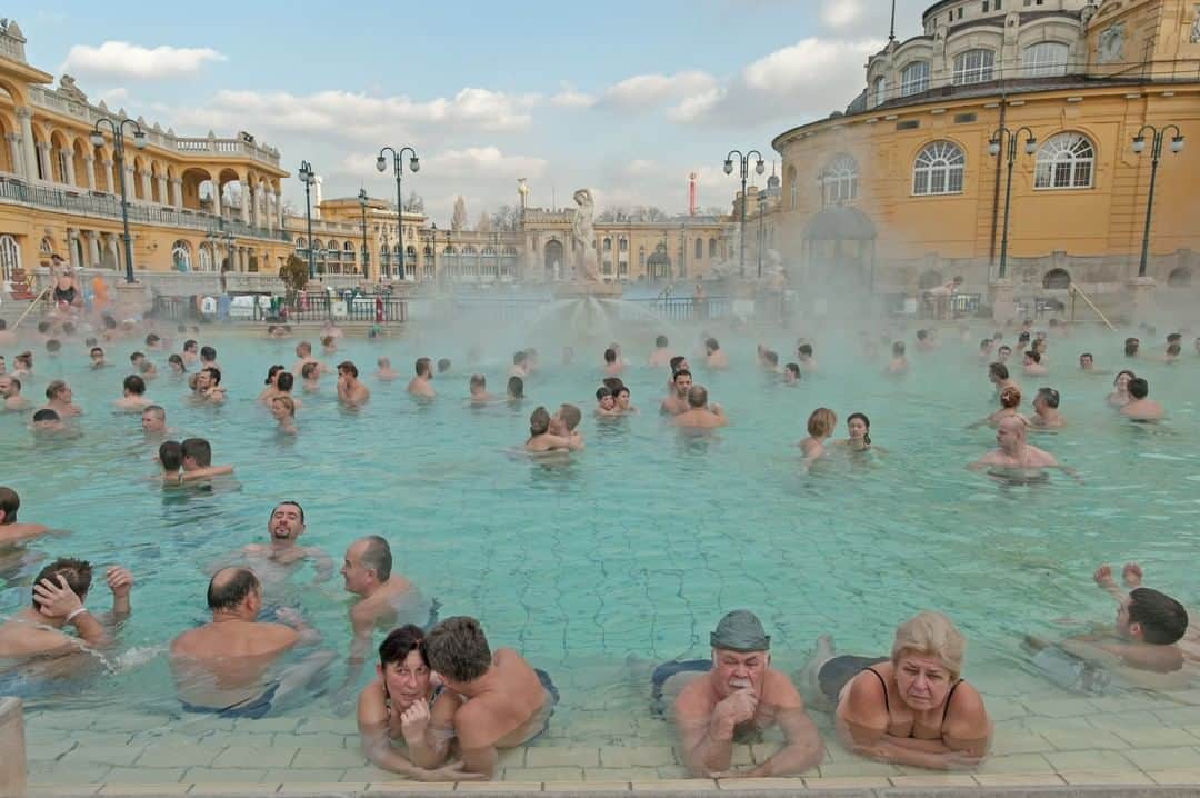 National Geographic Travelさんのインスタグラム写真 - (National Geographic TravelInstagram)「Photo by @amivitale | People relax in the healing waters of Szechenyi Baths in Budapest, Hungary, which has long been renowned for its health spas and thermal springs. This is one of the largest natural hot springs in Europe. About a hundred million bathers have enjoyed its warm medicinal waters over the last century. Many of these springs are connected underground by a huge thermal lake. The ancient Roman settlement of Aquincum, located on the outskirts of Budapest, is the site of the very first hot mineral water bath.  Follow @amivitale for more stories about the beauty and hope in the world. @natgeo @natgeocreative @thephotosociety #hungary #budapest #hotsprings #pools #spa」3月22日 1時07分 - natgeotravel