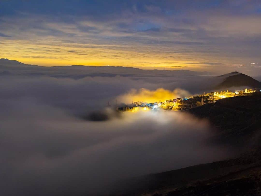 National Geographic Travelさんのインスタグラム写真 - (National Geographic TravelInstagram)「Photos by @babaktafreshi | A tender, misty evening falls over a village in the Alborz Mountains, photographed on a February 2018 trip to Iran. Swipe for a closer look. The country is currently facing a severe outbreak of coronavirus. I hope this view brings a moment of peace and hope. ⁣⁣#iran #alamut #alborz」3月24日 1時34分 - natgeotravel