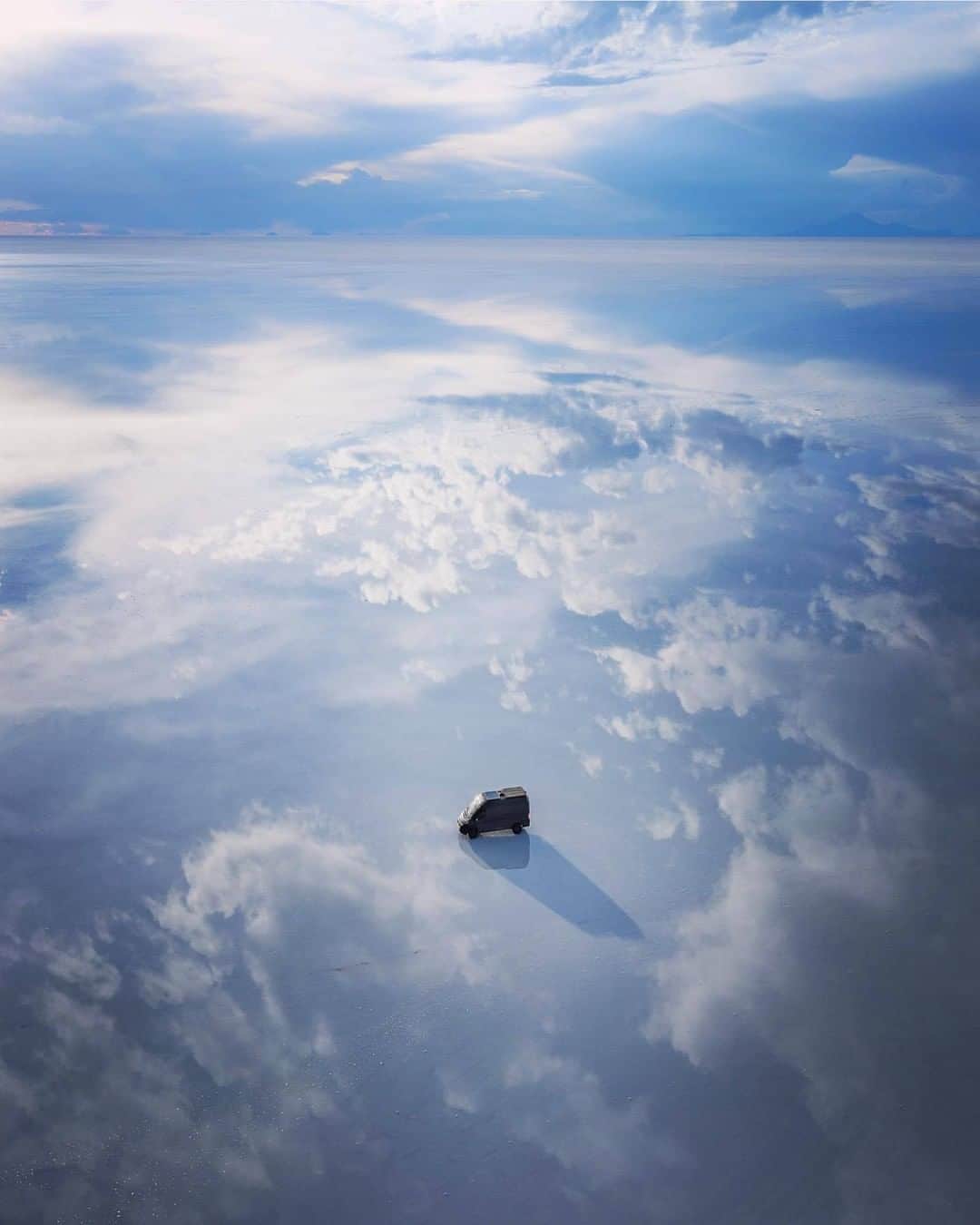 Discover Earthさんのインスタグラム写真 - (Discover EarthInstagram)「Let's hear from Quin's recent experience in South America @everchanginghorizon : "March 15th (6days ago) We fell asleep fast and happy, on the Bolivian Salt Flats. Woke up to concerned texts around 2am telling us that South American was shutting down. Up till that point South America had mostly stayed out of the COVID-19 news. In a few hrs everything changed, Peru (where we crossed from a day before) closed their borders, they weren’t letting anyone leave. Chile was closing their border in 2 days, Argentina closed their border and the parks we were planning to visit. The trip was over. We took the next few days to drive straight to Santiago, Chile , and I dropped @jess.wandering off at the airport. Then did some quick and expensive negotiating at a port to find someone to store the van and put it on the next sailing back to the states. It took me months to negotiate the shipment of the vehicle to South America, and one stressful day to negotiate the shipment back to North America. In the end, I was pretty happy to call it quits early on this trip. So many things went wrong, and a lot of them stemmed from having a new, shiny vehicle. I was worried this would happen. One of my last nights in Chile, I woke up terrified when someone opened my van door on me. I’d never experienced paranoia in my life, until now. Felt like a walking target with a lot to lose. Happy to be in a safe room at home with my family. We catch up from across the house, but it’s still quite a relief. Just hoping my van makes it back now." He still brought back an amazing picture ! 🇧🇴 #discoverbolivia」3月25日 22時00分 - discoverearth