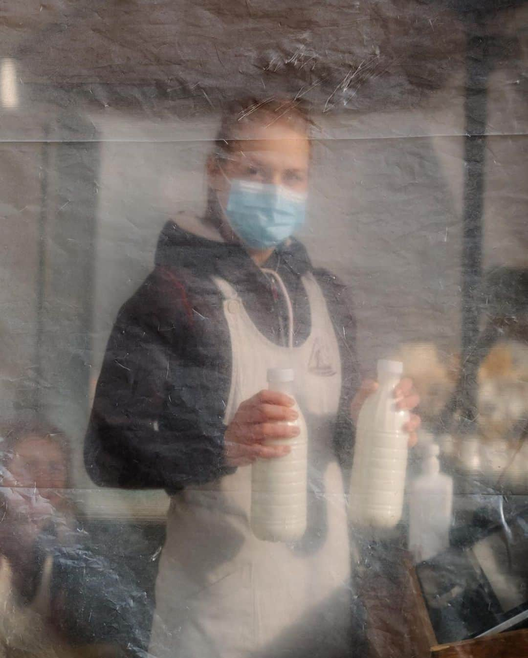 ナショナルジオグラフィックさんのインスタグラム写真 - (ナショナルジオグラフィックInstagram)「Photos by @ciriljazbec | With the outbreak of the coronavirus epidemic in Slovenia, I have struggled with how to visualize this story. Having two small kids at home, it's a scary prospect. Neighboring northern Italy, the current epicenter, is just two to three hours away from Ljubljana, our capital. Slovenia is now almost in a complete lockdown. I visited the nearby city of Kranj to walk around downtown. The emptiness was striking—only a few people rushing to get groceries. This is Ajda Bogataj from the Bogataj dairy at the market in Kranj. “Everything changed for everyone, but we try to keep working and supply people in this difficult time,” she says. Follow @ciriljazbec to see more.」3月27日 0時39分 - natgeo