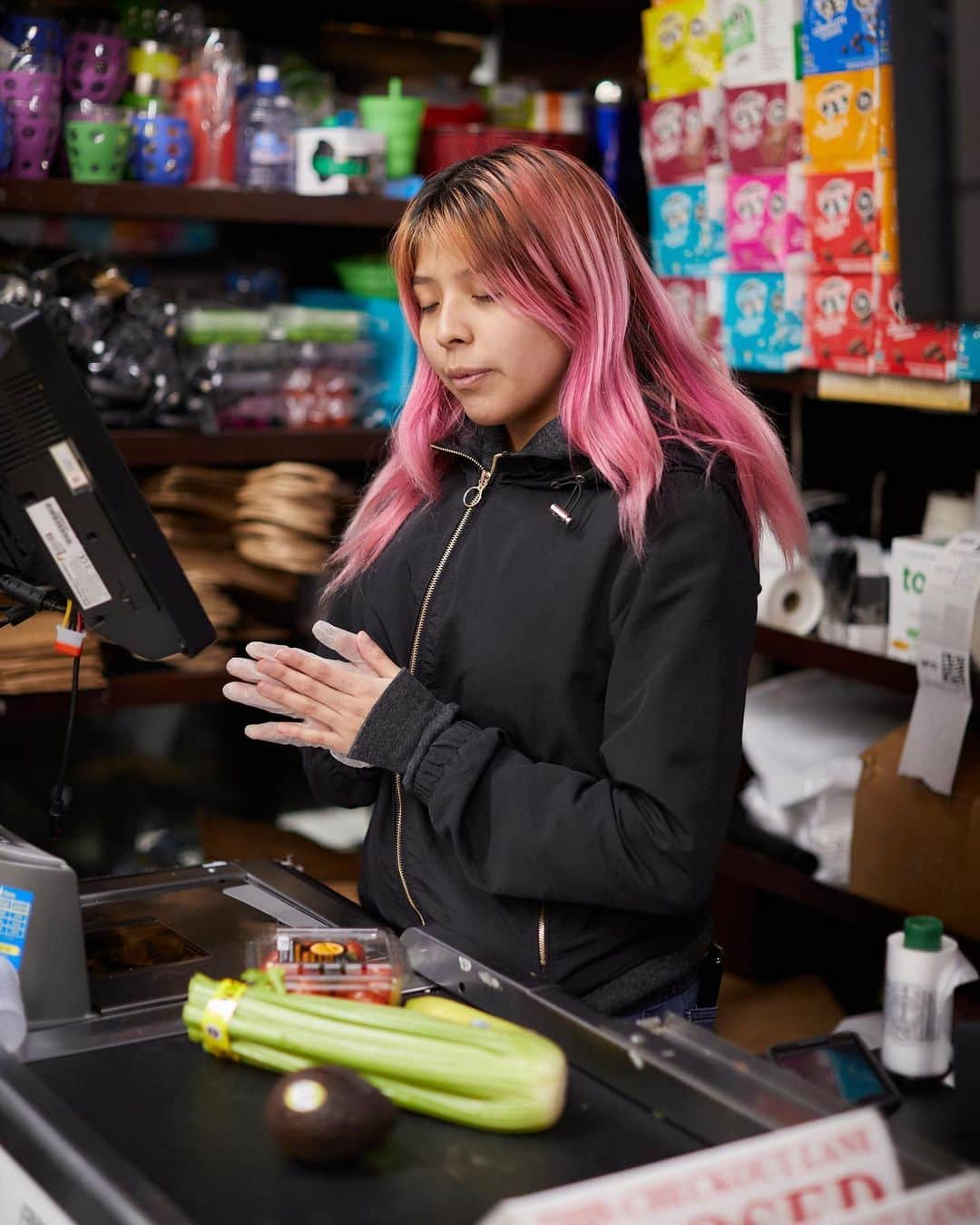 Vogueさんのインスタグラム写真 - (VogueInstagram)「With a face mask on and staying 6 feet away, photographer @strange.victory embarked on documenting the lives of the new first responders in New York: the city's grocery-store workers. Now among the city’s most crucial personnel, the grocery-store workers she spoke with know their roles have changed dramatically, with the current public health crisis turning them into a lifeline for families—and possibly the only other person a customer might talk to all day, or all week. Their jobs have grown to include absorbing and defraying the city’s tension; smiling, politely assisting. But they are also now exposed to new dangers.  Above: Viviana Robles, 22, from the Bronx, is a cashier at Westside Market in the East Village. “My mom is very weak and diabetic. I like hugging her and all that…but I try not to be that lovable with her [right now]. I say ‘I love you,’ but I could have some of the bacteria on my clothing, so, just in case, I haven’t been hugging as much.” “I do sometimes think about not coming in [to work], but someone else could take my spot here.” Tap the link in our bio to read more of their stories. Photographed by @strange.victory」3月27日 8時05分 - voguemagazine