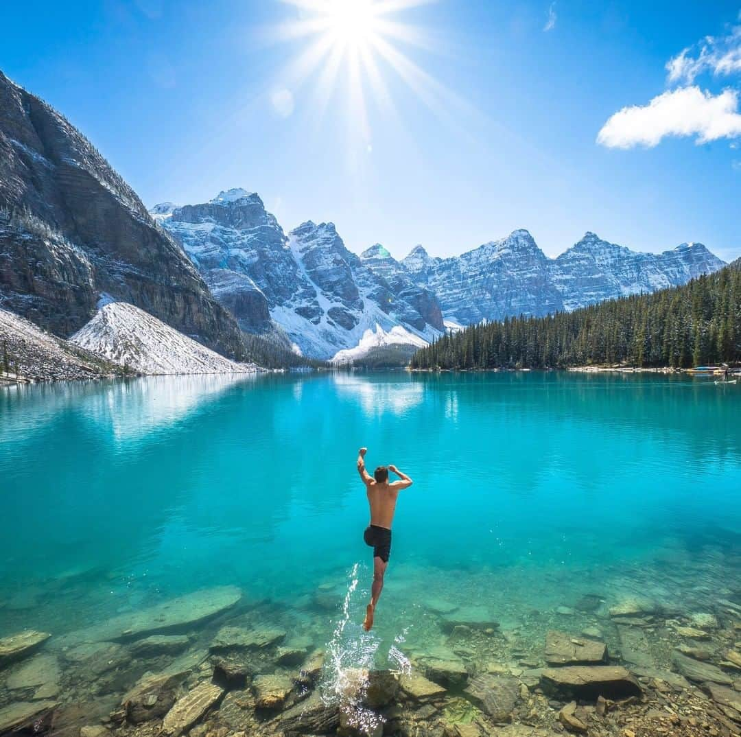 National Geographic Travelさんのインスタグラム写真 - (National Geographic TravelInstagram)「Photo by @chrisburkard | It has been said that in order to create images that inspire action, you must be part of that action. After a week of rain and sitting in a van, we would have done just about anything to enjoy the sunshine and clear water of Moraine Lake in Canada's Banff National Park. This is one of my favorite moments from a road trip through the Rockies. The rain cleared, the sun was shining, and we couldn’t help ourselves from jumping into the ice-cold, glacier-fed lake. It still inspires me to take advantage of every day the sun is shining.」3月29日 21時07分 - natgeotravel