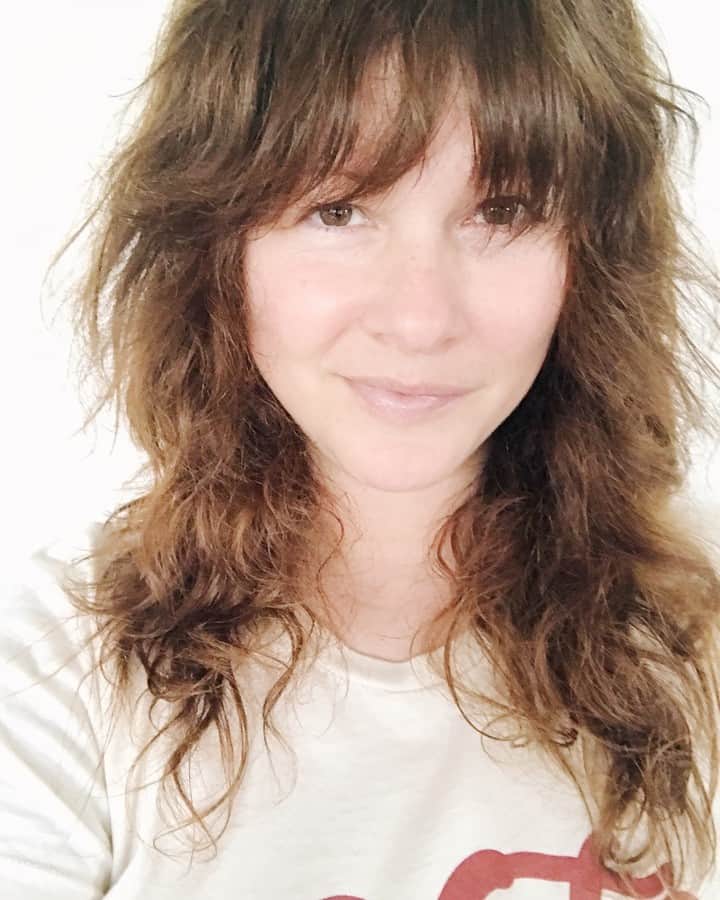 Robin May Flemingのインスタグラム：「Early in the morning hours of last Wednesday, I was nudged from sleep by the sound of coyotes. They yipped and howled and....whistled? Wait. What's that whistling sound? I pulled myself from my dreams and listened closely. It was me. My lungs were singing the strange swooping tune of a chorus of slide whistles. I turned on the light and I coughed and coughed. I'm sure versions of this story are being told all around the world right now. It's scary and beautiful how the human experience has coalesced. Now, more than ever, we're in this together. I'm fine. The whistles are fewer and farther between, more backyard bird than coyote. My energy's stirring again. I washed my hair and took this frizzy photo. Maybe it was just a cold. Or bronchitis. Or springtime allergies gone mad. Most of us will never know. So we keep our distance. And our fingers ache from texting. We check in more frequently. We hold each other more tightly in our thoughts. And we ride it out. Together, but apart. xo.」