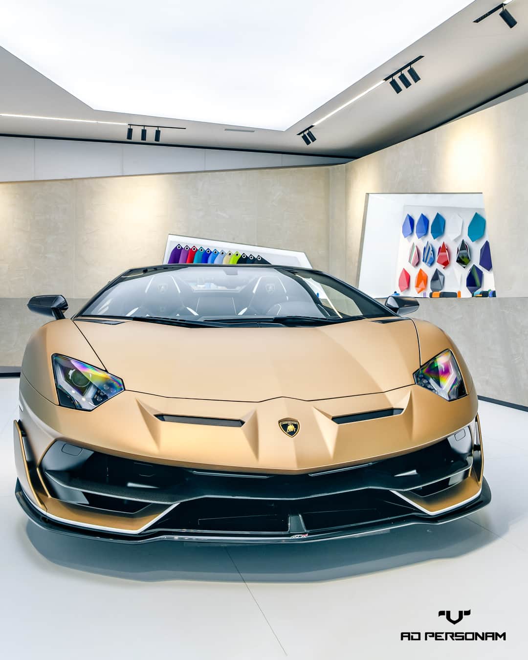ランボルギーニのインスタグラム：「Your touch is the extra edge it needs to become unique. Lamborghini Aventador SVJ Roadster with Bronzo Zenas body color and Bianco Phanes painted livery: a one-of-a-kind Super Sports Car, thanks to our Ad Personam program.  #Lamborghini #AventadorSVJRoadster #AdPersonam #MakeItUnique」