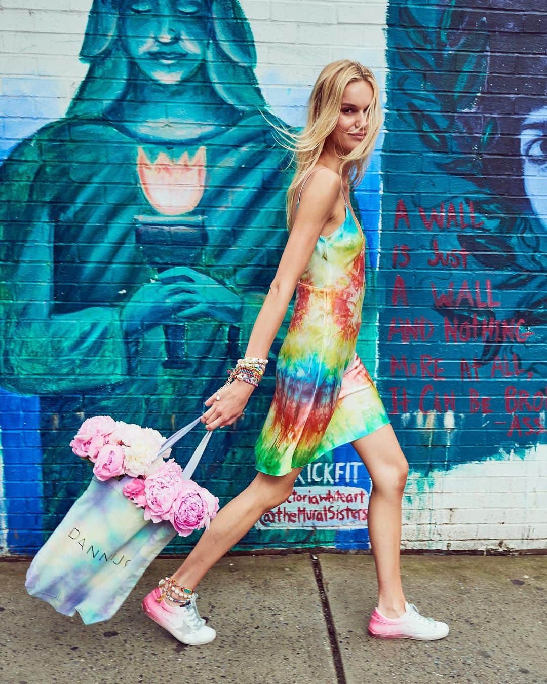 ダニジョーのインスタグラム：「The girl on the go 💃🏻🌈 tap to shop the #tiedye mini slip we’re all obsessed with • 📷 @sloanisabuller」
