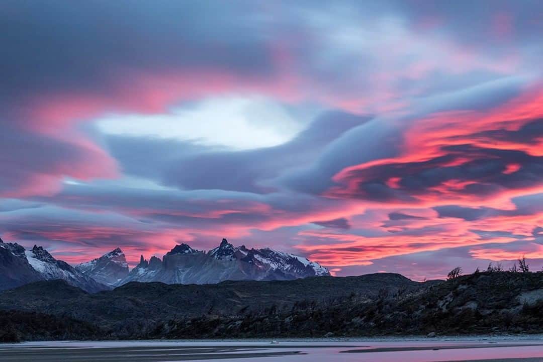 National Geographic Travelさんのインスタグラム写真 - (National Geographic TravelInstagram)「Photo by @DaisyGilardini | Patagonia is known for its strong winds and beautiful lenticular clouds. Lenticular clouds typically form over mountain peaks where there’s moisture. Lenticulars are also called standing wave clouds, because they’re associated with waves in the atmosphere. They develop when strong winds push air over a mountain. What is interesting is that the clouds stand still and remain stationary. Though wind may move through them, it doesn’t push them. Instead, the clouds change shape by continually forming and dissipating around the crest of the wave of moisture. Follow me @DaisyGilardini for more images and stories behind the scenes. #patagonia #chile #clouds #lenticularclouds #landscapephotography」8月8日 13時02分 - natgeotravel