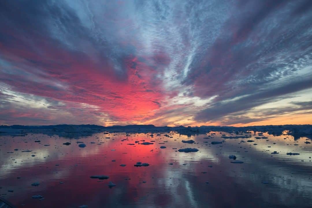 National Geographic Travelさんのインスタグラム写真 - (National Geographic TravelInstagram)「Photo by @acacia.johnson | A blazing sunset reflects off a sea of icebergs in Ilulissat, West Greenland. Home to the most productive glacier in the Northern Hemisphere, Ilulissat offers spectacular opportunities to view glacial ice - an estimated 20 billion tons of it calved per year, flowing at a rate of 20-35 meters per day. Follow me at @acacia.johnson for more adventures from the Arctic and beyond. #arctic #ilulissat #greenland」8月9日 13時03分 - natgeotravel