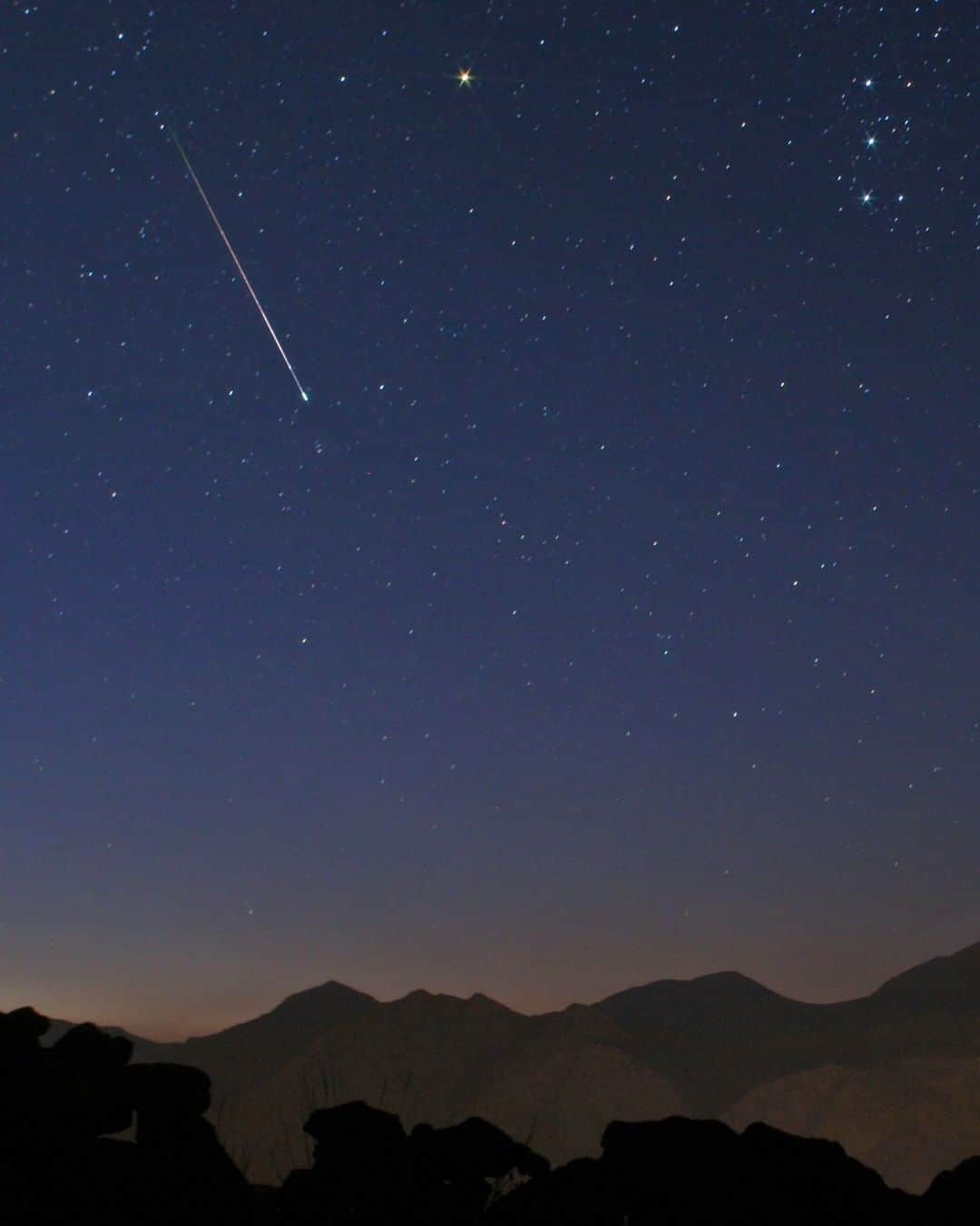 National Geographic Travelさんのインスタグラム写真 - (National Geographic TravelInstagram)「Photo by @babaktafreshi | Streaking the morning sky on the peak night of Perseid Meteor Shower on the night of August 12-13. This year the nearly full moon hides away some of the meteors but still the brighter fireballs will turn on your sleepy eyes! The moon sets near 4 am and depending on your position there is about an hour of dark sky before dawn when you may see 1 or 2 meteors per minute, more strikingly visible away from light pollution. Perseids don’t necessarily appear near the shower radiant in constellation Perseus, they can be anywhere in the sky and more after midnight. Follow me @babaktafreshi for more of astronomy and space photography. #meteorshower #perseids #stargazing #twanight」8月9日 19時01分 - natgeotravel