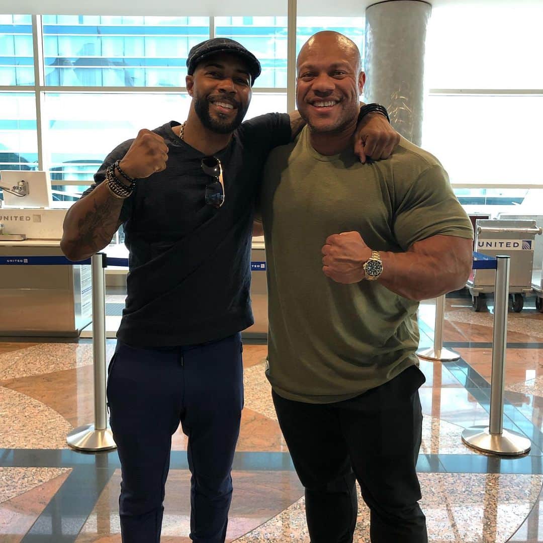 Phil Heathのインスタグラム：「Talk about some “POWER” huh!!!! Great seeing my Brother @omarihardwickofficial at the airport today and finally having time to really chat instead of over the phone. It’s rare that I get to share space with someone so liked minded as we both are constantly pushing ourselves to become our greatest versions day in and day out. Safe travels my Man and can’t wait to get some training in with ya soon! 💪🏽💪🏽💪🏽💪🏽 #PhilHeath #OmariHardwick #PowerMoves」