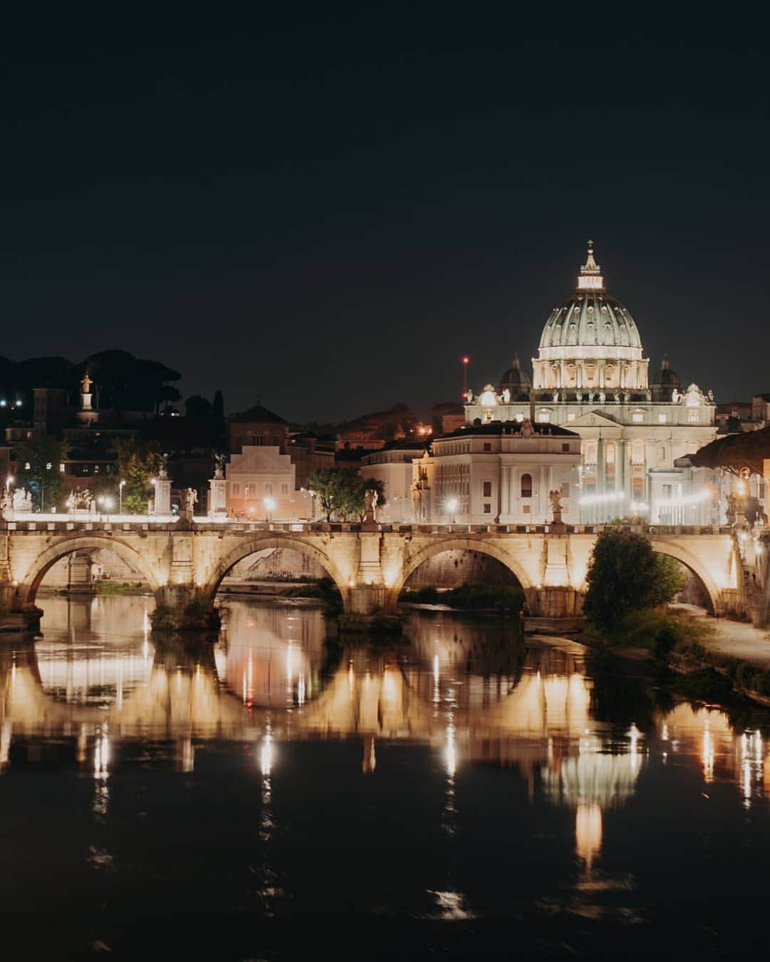 Putri Anindyaのインスタグラム：「When in Rome // have you visited Rome? Where's your fav place there?  the last two days before I went back to Paris was wonderful. I got to stay in @hoteledenrome and experience the wonderful landmarks that located in radius 2km from the hotel.  Here you'll see the view of St Angelo Bridge with St Peter Basilica that looks like diamond by night. Then when you slide, it's the gorgeous Trevi Fountain that you can visit before breakfast time (because it's very crowded). On the third slide you'll see famous Spanish steps of Rome. So just a tip, you have to come here early morning when there is less people and come to Trevi first because it's the most crowded place in Rome. Then walk to Spanish Steps because both are very close. And the last slide is a night pict of St Angelo bridge itself.  All of the places are located near from the @hoteledenrome #atasteofeden #dcmoments.」
