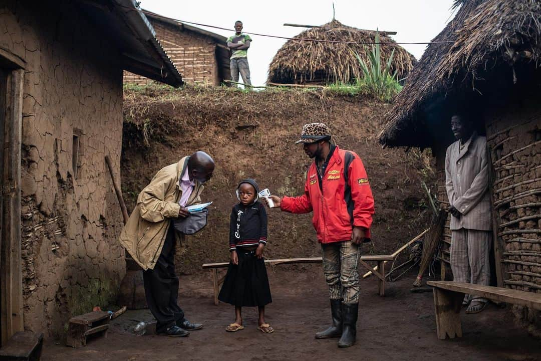 thephotosocietyさんのインスタグラム写真 - (thephotosocietyInstagram)「Photo by @nicholesobecki // After almost a year, and nearly 1700 deaths, the Ebola outbreak in the Democratic Republic of Congo has been declared a Global Health Emergency. Emergency declarations are issued sparingly, and only four have been made in the past. Here, a World Health Organization team checks the temperature of Confirme Masika Mughanyira, 7, in Vayana town, a small village two-hours from Butembo in North Kivu. Confirme lost both her parents, her older brother and younger sister to Ebola. As the only survivor in her family she is now being taken care of by relatives. To learn more about the perfect storm that is making it so difficult to stop this epidemic follow me @nicholesobecki #ebola #drc #congo #health #emergency」7月19日 2時33分 - thephotosociety