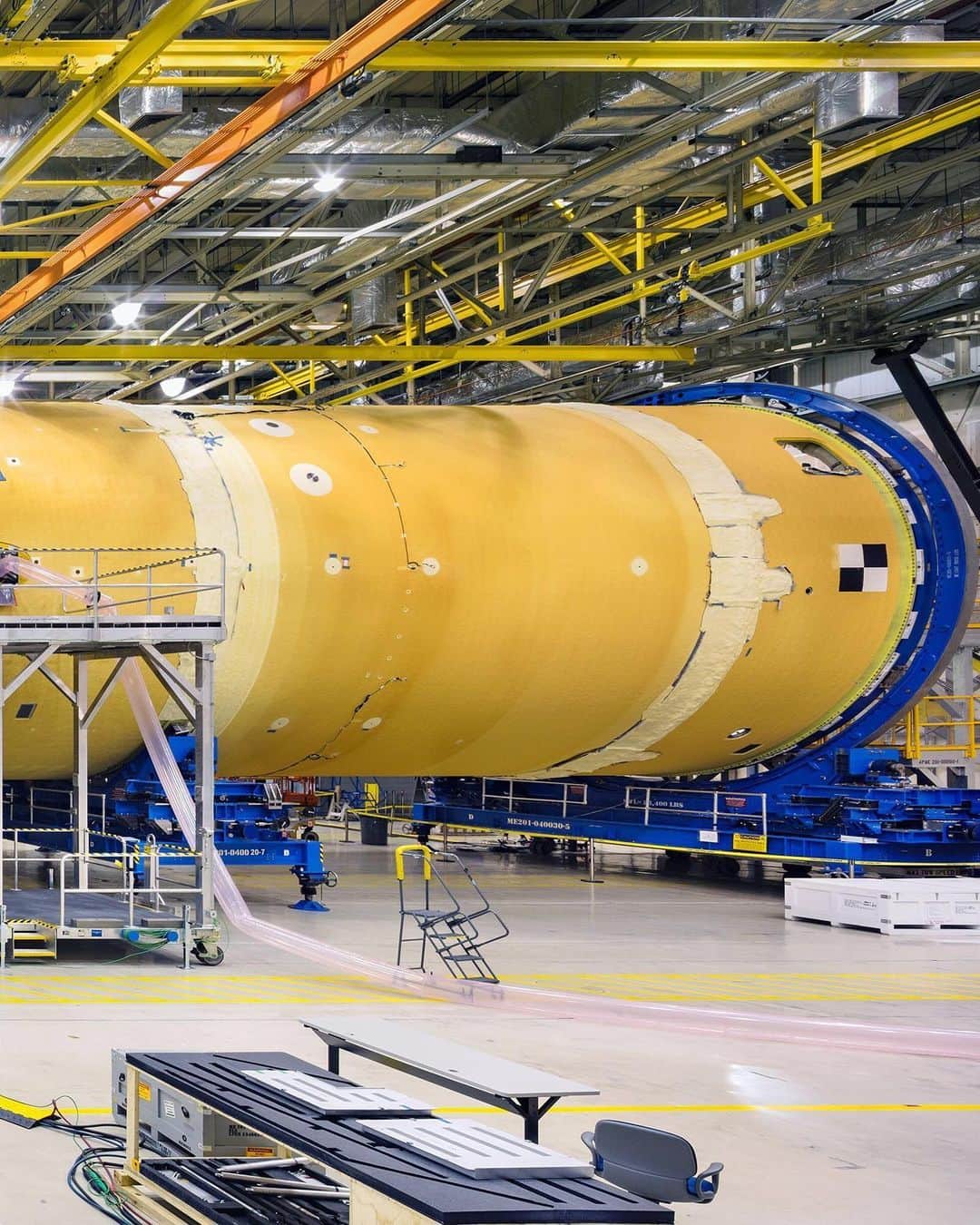 TIME Magazineさんのインスタグラム写真 - (TIME MagazineInstagram)「@nasa workers assemble the core stage of the Space Launch System, the backbone of the moon rocket. The SLS has been in start-stop development since 2005, with flat funding leading to repeatedly missed deadlines. Earlier this year, the Government Accountability Office issued a report finding that the SLS, the Orion orbiter and related systems have cost about $16 billion so far, some $1.8 billion more than was planned, largely thanks to delays. Now, however, the #space agency insists the SLS is almost ready, and has an ambitious schedule, with the first crewed mission for around the #moon planned for 2023. “This time when we go to the moon … we’re going to go sustainably,” says #NASA administrator Jim Bridenstine. “We’re going to learn how to live and work on another world so that we can eventually go to Mars.” Read this week’s full cover story by Jeffrey Kluger, and see more of our #Apollo50th coverage, at the link in bio. Photograph by @christopherpaynephoto for TIME」7月19日 3時51分 - time