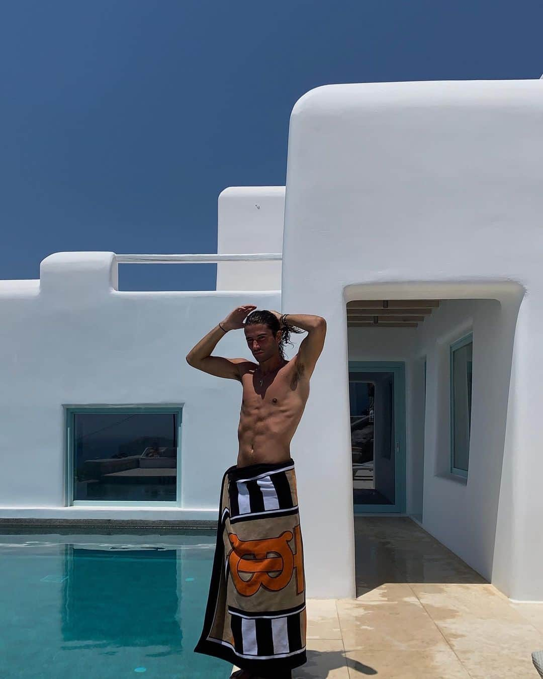 Burberryさんのインスタグラム写真 - (BurberryInstagram)「#Burberry in Mykonos . @MarcForne celebrates the launch of the new #BurberrySummer capsule by the poolside, wearing the striking #ThomasBurberryMonogram print towel . #TBRT #BurberryGeneration」7月19日 17時08分 - burberry