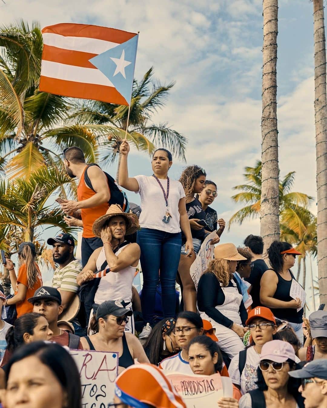 TIME Magazineさんのインスタグラム写真 - (TIME MagazineInstagram)「A woman waves a Puerto Rican flag on July 17 as thousands of protesters again gathered in San Juan to demand the resignation of #PuertoRico Gov. Ricardo Rosselló following the leak of offensive chat messages. The #rickyrenuncia demonstration followed the arrests of two of Rosselló’s top officials on charges of fraud, inflaming anger over what many say is the Puerto Rican government’s incompetence and corruption following Hurricane Maria in 2017. Rosselló remains defiant, claiming he has not committed any illegal acts but is apologetic for his inappropriate messages. For many on the ground, forcing his resignation would be just the first step in fixing a government they feel has let them down when they needed them the most. Read more about how they got to this point at the link in bio. Photograph by @cgregoryphoto for TIME」7月19日 10時02分 - time