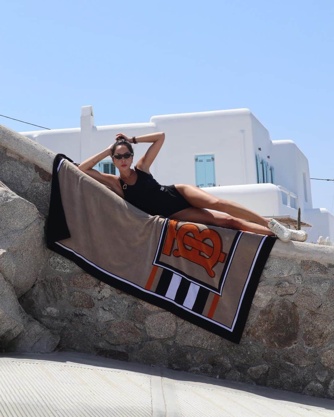 Burberryさんのインスタグラム写真 - (BurberryInstagram)「#Burberry in Mykonos . Captured on the Greek island, @Dana.Hourani wears the logo detail swimsuit with the #ThomasBurberryMonogram print towel . A celebration of #BurberrySummer . #TBRT #BurberryGeneration」7月19日 21時26分 - burberry