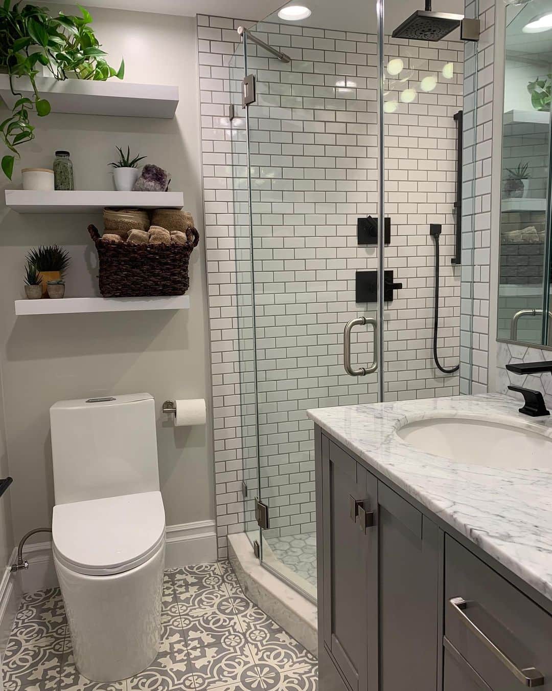 ブラント・ドーハティのインスタグラム：「Check out the before pic! When we bought this house, we knew our half bathroom needed a facelift (and a shower!) I think we did alright.  Tile: @thebuilderdepot  Toilet: @swissmadison  Vanity light: @lustrouslumens」
