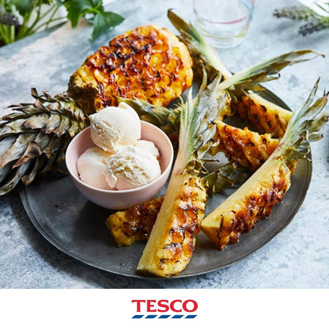Tesco Food Officialさんのインスタグラム写真 - (Tesco Food OfficialInstagram)「No, we’re serious. When it comes to desserts, BBQ’d pineapple is like the tropical sunset to an epic day of grilling - gently charred, slightly caramelised and tenderly juicy.  Ingredients 1 pineapple 1 tbsp sunflower oil (or vegetable oil) 1 tbsp Demerara sugaar  1.Preheat BBQ as required. Once it’s ready (coals should be white-grey and flames died right down), move the hot coals to one side so there’s an area of the grill away from the main heat. For gas BBQs, preheat to medium-low.  2.With leaves still attached, stand the pineapple upright and (starting at top), use a sharp knife to slice downwards to remove skin. For any hard bits remaining, lay the pineapple flat and use a small knife to cut them out. Finish by trimming the base.  3.Rub pineapple with 1 tbsp sunflower or vegetable oil, sprinkle with 1 tbsp Demerara sugar, rubbing it in so it sticks to the flesh.  4.Using stem and leaves as a handle, lay the pineapple flat on the grill (away from coals) so that it can cook slowly over an indirect heat.  5.Check the pineapple after 5 min, lifting carefully to see if the underside has coloured – it should be golden and caramelised. If it is blackening too quickly, move away from the hot coals (or if not enough, move towards). 6.Once one side is cooked, use the leaves to turn the pineapple over; leave to grill until ready. Keep turning every 5 mins or so until lightly charred and golden-brown all over, the flesh should feel soft when a small sharp knife is pushed in all the way to the core. The total cooking time may vary but should be about 30-50 mins.  7.Lay the cooked pineapple flat on a board. Use a large sharp knife to slice lengthways through the middle, then cut each half into 3 long wedges and remove the core. Serve as long wedges or remove the leaves and halve or quarter into shorter pieces.  8.Serve warm, on its own or perhaps with a scoop of vanilla ice cream or dollop of yogurt.」7月21日 21時03分 - tescofood