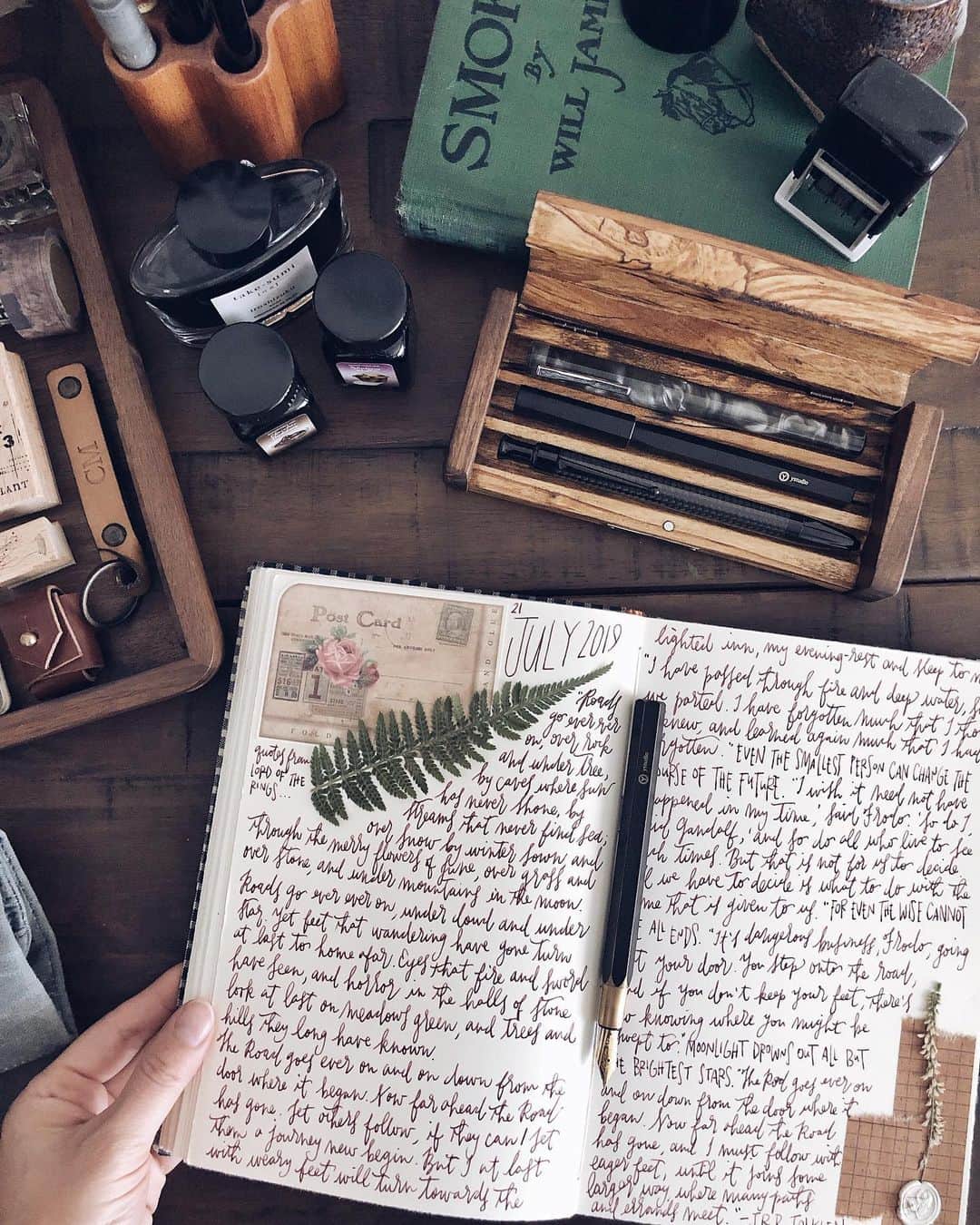 Catharine Mi-Sookさんのインスタグラム写真 - (Catharine Mi-SookInstagram)「“Roads go ever ever on, Under cloud and under star. Yet feet that wandering have gone Turn at last to home afar. Eyes that fire and sword have seen, And horror in the halls of stone Look at last on meadows green, And trees and hills they long have known.” -J.R.R. Tolkien . . . . Brassing Desk Pen @ystudiostyle inked with the stunning new color Blueberry Muffin from @monteverdepens_official Sweet Life inks. Jackson Journal in the Companion size & Mini Sendak in slate waxed canvas @pegandawl. Writing Box & Wooden Pen Holder @galen_leather. . . . . #jrrtolkien #journaling #dailyjournal #ystudio #fountainpens #penmanship #teammonteverde #monteverde #fountainpenink #galenleather #writingbox #loveforanalogue #stationery #stationerylove #pegandawl #creativejournaling #creativejournal #creativespace #desksetup #deskgoals #plannernerd #thedailywriting #abmspaces #scrapbooking #scrapbooklayout #thingsorganizedneatly」7月22日 3時59分 - catharinemisook