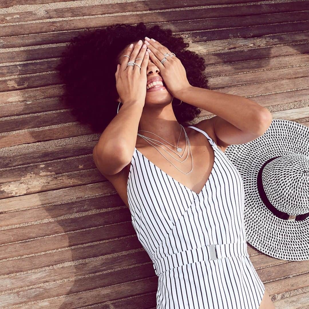アクセサライズのインスタグラム：「Wake us up when it's the weekend. ⏰ Our navy stripe swimsuit puts an ultra-chic spin on the nautical look. Figure-flattering it has a wrap neckline and belted waist. Pair with the mono feather hat. 🔍 Hat - 7911429000 🔍 Swimsuit - 7970934106 Tap the link in the bio to shop now.  #Accessorize」