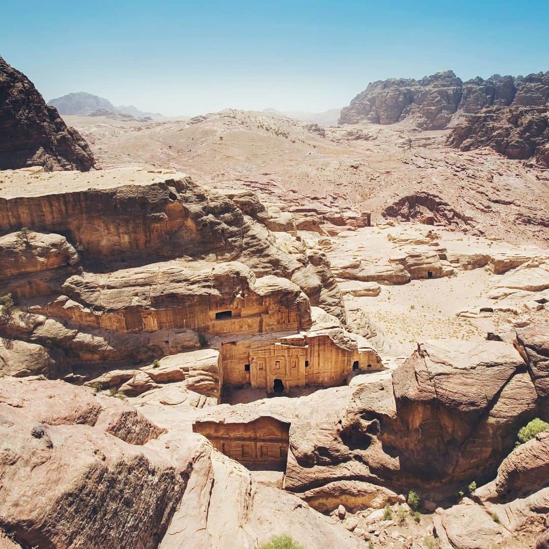 National Geographic Travelさんのインスタグラム写真 - (National Geographic TravelInstagram)「Photo by @andrea_frazzetta | Petra, the “Rose City” is a honeycomb of hand-hewn caves, temples, and tombs carved from blushing pink sandstone in the high desert of Jordan some 2,000 years ago. Hidden by time and shifting sand, Petra tells of a lost civilization. Little is known about the Nabateans—a nomadic desert people whose kingdom rose up from these cliffs and peaks, and whose incredible wealth grew from the lucrative incense trade. Petra was only rediscovered in 1812, and it continues to spill its secrets. Even now, archaeologists have explored less than half of the sprawling site, and in 2016, with the help of satellite imagery, a monumental structure was found still buried in the sand. It’s no wonder that Petra remains Jordan’s top tourist attraction and one of the most revered of the World Heritage sites. To see more photos from my travels, follow me @andrea_frazzetta #jordan #petra #natgeotravel」7月22日 19時04分 - natgeotravel
