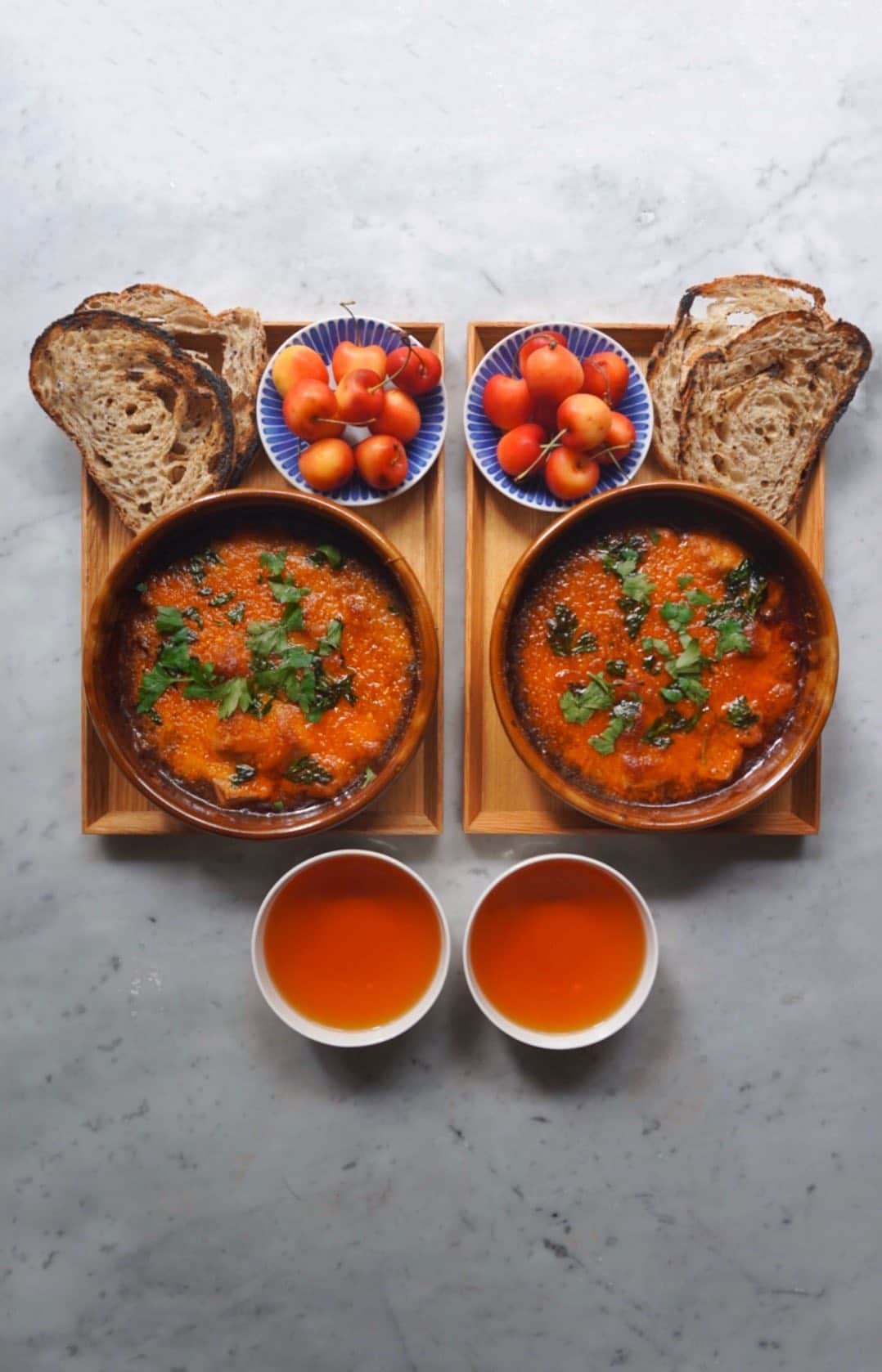 Symmetry Breakfastのインスタグラム：「Mapo Doufu with CHEESE! Move over shakshuka. A true icon of Chinese cooking is welcomed into the world of breakfast/brunch. Leave the pork out for a vegan recipe and give it a go at the weekend #symmetrybreakfast - - - - - - - - - - - - - - - - - - - - - 1 tbsp fermented black beans, mashed 2 tbsp chilli oil or chilli paste - You can use doubanjiang, which is often both combined, but I prefer separate so I can control saltiness and spiciness  2 cloves garlic, minced/grated 2 tsp Sichuan peppercorns 50g piece of belly pork, minced 3 red chillis, finely chopped 2 tbsp light soy sauce 2 tbsp black Chinese vinegar 2 tbsp rice wine 240ml (1 cup) vegetable stock 400g soft firm tofu (not silken tofu!) 1 tsp of grape seed or vegetable oil  Drizzle of sesame oil for garnish Pinch of sugar  1 tsp cornflower - - - - - - - - - - - - - - - - - - - - - 1 - Pick out the hard stone from the peppercorn if any and discard, toast the peppercorn in a dry frying pan until fragrant. Leave to cool and crush into a powder 2 - In a cold wok, add the grapeseed oil and pork belly and cook on medium low for 15 minutes. 3 - Add the fermented black beans, cook for 5 minutes, then add the garlic and sugar 4 - Add the chilli oil or paste and fresh chilli and cook for a further 5 minutes  5 - Add the soy sauce, vinegar and rice wine. 6 - Add the vegetable stock and cook for a further 10 minutes  7 - Mix the cornflour with a dash of cold water to make a paste, add this to your sauce. Bring it up to a gentle boil for 5 minutes to thicken 8 - Add the ground Sichuan peppercorn and stir through  9 - Prepare a pan with boiling salted water 10 - Cut the tofu into cubes, roughly 1 inch/2cm cubes 11 - Gently add the tofu to the boiling water, try not to touch it and after 4-5 minutes, remove the tofu and drop into the sauce. 12 - Simmer for a further 5-10 minutes and serve over white rice or cover it in CHEESE and stick it under a grill/broiler」