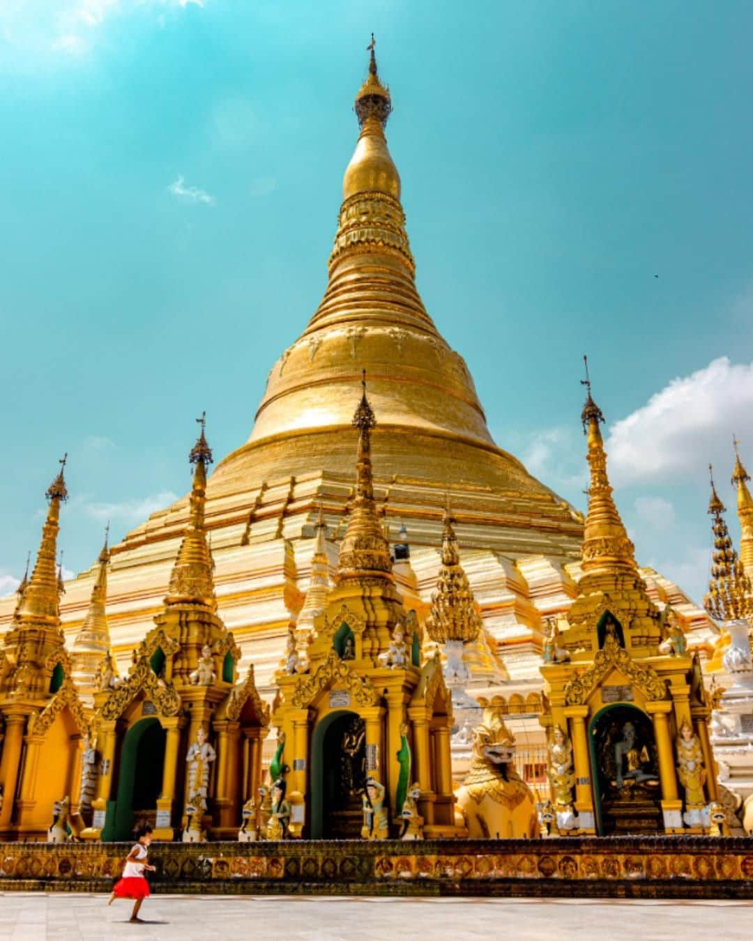 Canon Asiaのインスタグラム：「“I took this shot during a morning visit to the golden Shwedagon Pagoda, representing the faith and life of the people in Myanmar. A little girl with red shorts ran into the shot, so I seized the moment to capture the delight of youth within this iconic place of worship. Everything was so mythical and beautiful." • Provide a sense of scale in your photo by adding a human element to it. Take a hint from this shot by @alexchang1103! By including the secondary subject of the carefree little girl 👧 in mid-stride, the sheer grandeur 🌟 of the magnificent temple is emphasized. • 📷 Image by @alexchang1103 shot using the Canon EOS 77D | f/7.1 | 1/1000s | ISO 100 | 16mm  Want your photos to be featured too? Tag them with #canonasia or submit them on My Canon Story, link in bio!  #canonasia #photography #myanmar #yangon #myanmartravel #myanmartrip #shwedagon #shwedagonpagoda」