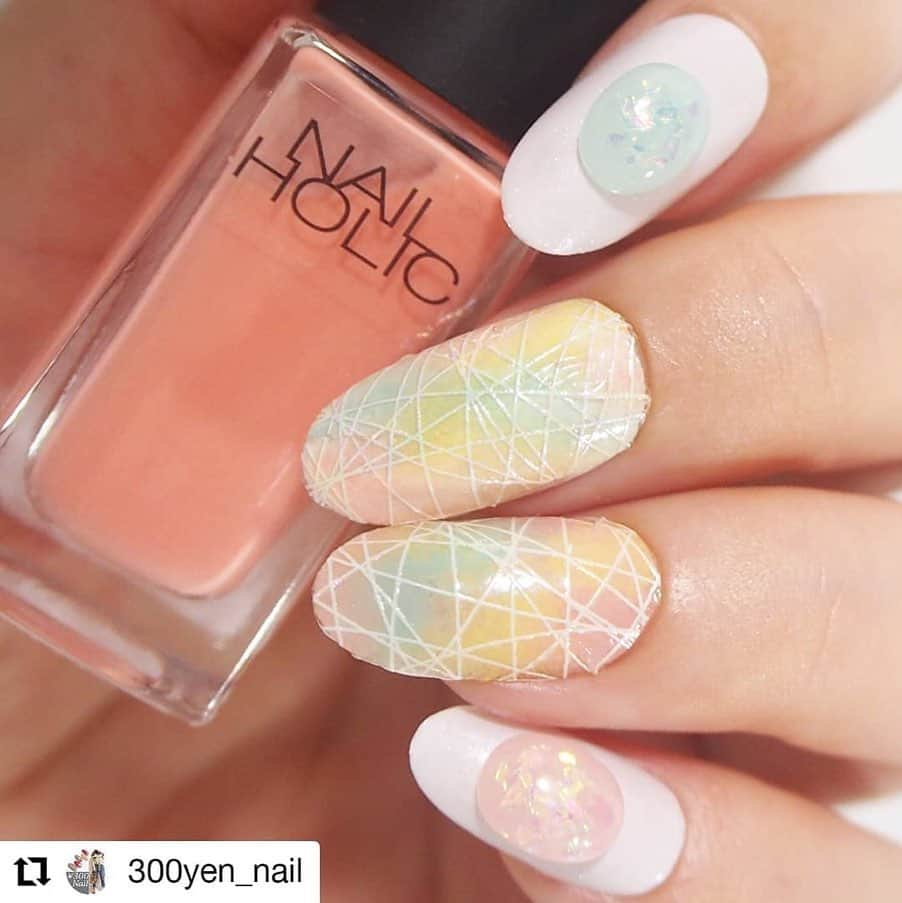 NAIL HOLICさんのインスタグラム写真 - (NAIL HOLICInstagram)「​⠀ 今回は @300yen_nail さまの投稿をRepostさせていただきます！⠀ ⠀ ネイルホリックを使用したレインボーわたあめネイル❤️⠀ スポンジを使ったアレンジで、わたあめのふわふわ感を演出♪⠀ ⠀ いつも使っているネイルカラーでも、アレンジ一つで違うニュアンスになれますね！⠀ How to動画も投稿して頂いているので、ぜひ参考にしてみてくださいね☆⠀ ⠀ @300yen_nail さまもご参加いただいている⠀ 『✨公式アンバサダー募集企画✨』は7/31まで！⠀ みなさまのネイルホリックの豊富なカラバリから、イチオシカラーを選んで投稿してください💕⠀ ⠀  #nailholic #ネイルホリック #ネイル #nails #nail #nailpolish #nailholic_kose #nailart #nailsofinstagram #セルフネイル #セルフネイル部 #ネイルアート #プチプラ #プチプラネイル #マニキュア #マニキュアネイル #マニキュア派 #セルフマニキュア #ネイルデザイン #ネイル好きな人と繋がりたい #おしゃれさんと繋がりたい #手元コーデ #手元くら部 #repost⠀ ⠀ ・・・⠀ ⠀ レインボーわたあめネイル😋 ダイソーのネットステッカーをどうデザインするか、ずっと考えていて思いついたものです💡🤔✨ . . ▽アイテム▽ ネイルホリック @nailholic_kose  ベースコートSP031、トップコートSP041、ホワイトWT013、グリーンGR711、ピンクPK811、イエローYE501 各300円 セリア ネイルパーツ シュガーストーン10P 100円 ダイソー ネイルネットステッカー 100円  #私のイチオシカラーネイル #ネイルコンテスト07 #nailholic_kose #PK811 #くみこのフォロワー感謝祭15k #くみこのフォロワー感謝祭くみこ賞」7月25日 17時00分 - nailholic_kose