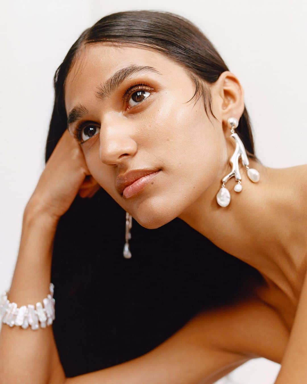 British Vogueさんのインスタグラム写真 - (British VogueInstagram)「Cool-girl pearls are this summer's cult jewellery buy. And thanks to the raft of independent jewellers that spearheaded the seashell obsession, organic forms have taken a turn for the hyper-precious. Click the link in bio to shop #BritishVogue’s edit of the best baroque pearl pieces to be seen in this summer.  @_ClubM8_ photographed by @BenjaminVnuk and styled by @ItsDWallace, with hair by @AliPirzadeh, Make-up by @LauraDomini2 and nails by @RobbieTomkins for the July 2019 issue of British Vogue.」7月25日 18時14分 - britishvogue