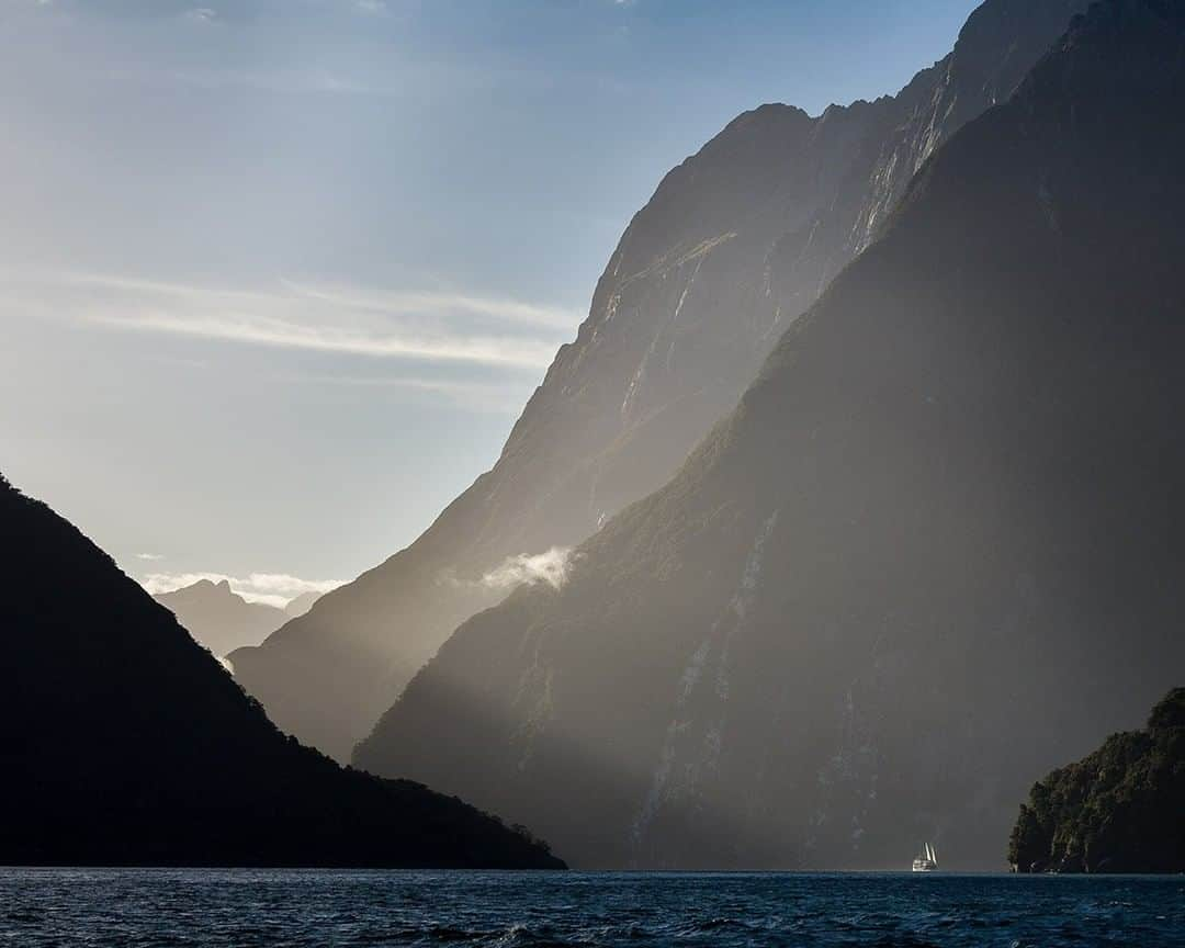 National Geographic Travelさんのインスタグラム写真 - (National Geographic TravelInstagram)「Photo @stephen_Matera | Looking back towards Milford Sound and Mitre Peak from Anita Bay, Fiordland National Park, New Zealand. A not-so-small ship is dwarfed beneath the massive north face of Mitre Peak, a well-known peak that rises over 5,500' (1,683 meters) above the waters of Milford Sound. Mildford Sound is a UNESCO World Heritage site. Follow me @stephen_matera for more images from New Zealand and around the world. #UNESCO #milfordsound #mitrepeak」7月25日 19時03分 - natgeotravel