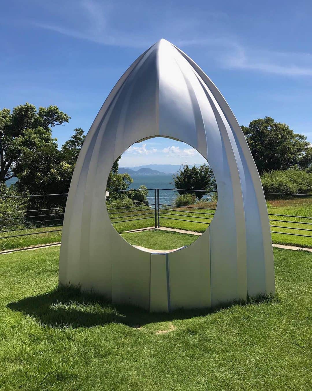 バーニーズ・ニューヨークのインスタグラム：「Tucked deep within the inlands of Japan lie the idyllic island town of Naoshima. This rural town is known as an international art destination, and is packed with museums, installations, and architectural sites — works by Eastern and Western contemporary artists ranging from @jamesturell to Yayoi Kusama can be found scattered throughout.  Barneys’ Editor-in-Chief @luxomancer took these #bnyvoyage photos while exploring the Benesse House Museum in Naoshima. With summer in full swing, tell us what your dream destination is — no matter how far flung or crazy (still waiting for Elon Musk to offer luxury getaways to Mars).」