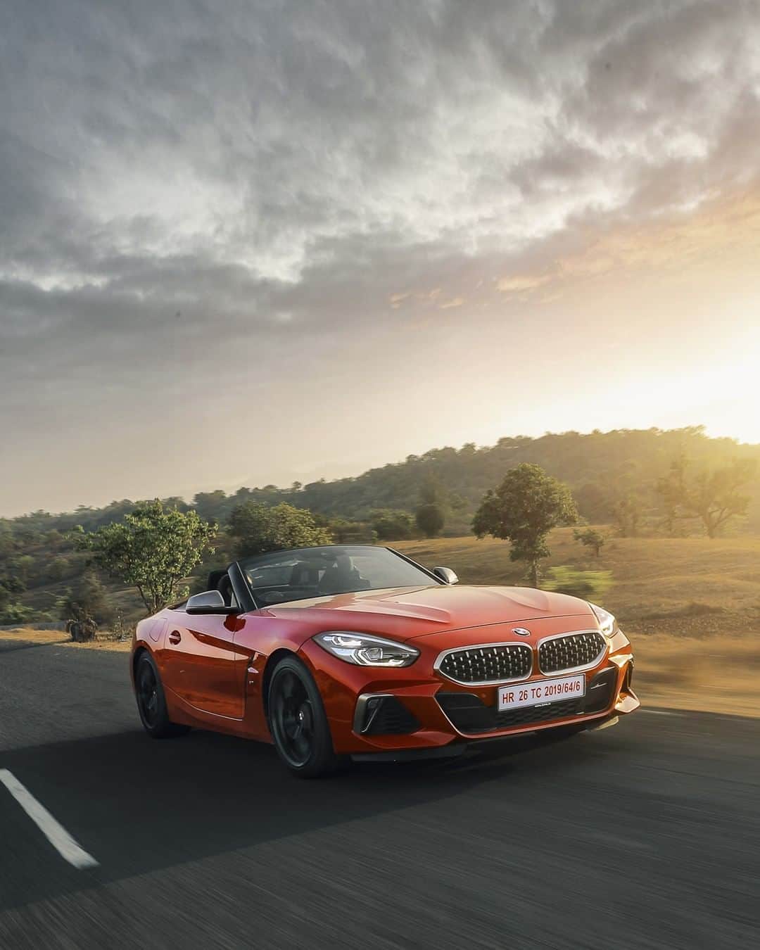 BMWのインスタグラム：「Dive into sunshine. The BMW Z4. #TheZ4 #BMW #Z4 #BMWrepost @annishaikh1990 __ BMW Z4 M40i: Fuel consumption in l/100 km (combined): 7.4. CO2 emissions in g/km (combined): 168.  Acceleration (0-100 km/h): 4.5 s. Power: 340 hp, 500 Nm. Top speed (limited): 250 km/h. Paint finish shown: San Fransisco Red metallic.  The values of fuel consumptions, CO2 emissions and energy consumptions shown were determined according to the European Regulation (EC) 715/2007 in the version applicable at the time of type approval. The figures refer to a vehicle with basic configuration in Germany and the range shown considers optional equipment and the different size of wheels and tires available on the selected model. The values of the vehicles are already based on the new WLTP regulation and are translated back into NEDC-equivalent values in order to ensure the comparison between the vehicles. [With respect to these vehicles, for vehicle related taxes or other duties based (at least inter alia) on CO2-emissions the CO2 values may differ to the values stated here.] The CO2 efficiency specifications are determined according to Directive 1999/94/EC and the European Regulation in its current version applicable. The values shown are based on the fuel consumption, CO2 values and energy consumptions according to the NEDC cycle for the classification. For further information about the official fuel consumption and the specific CO2 emission of new passenger cars can be taken out of the „handbook of fuel consumption, the CO2 emission and power consumption of new passenger cars“, which is available at all selling points and at https://www.dat.de/angebote/verlagsprodukte/leitfaden-kraftstoffverbrauch.html.」