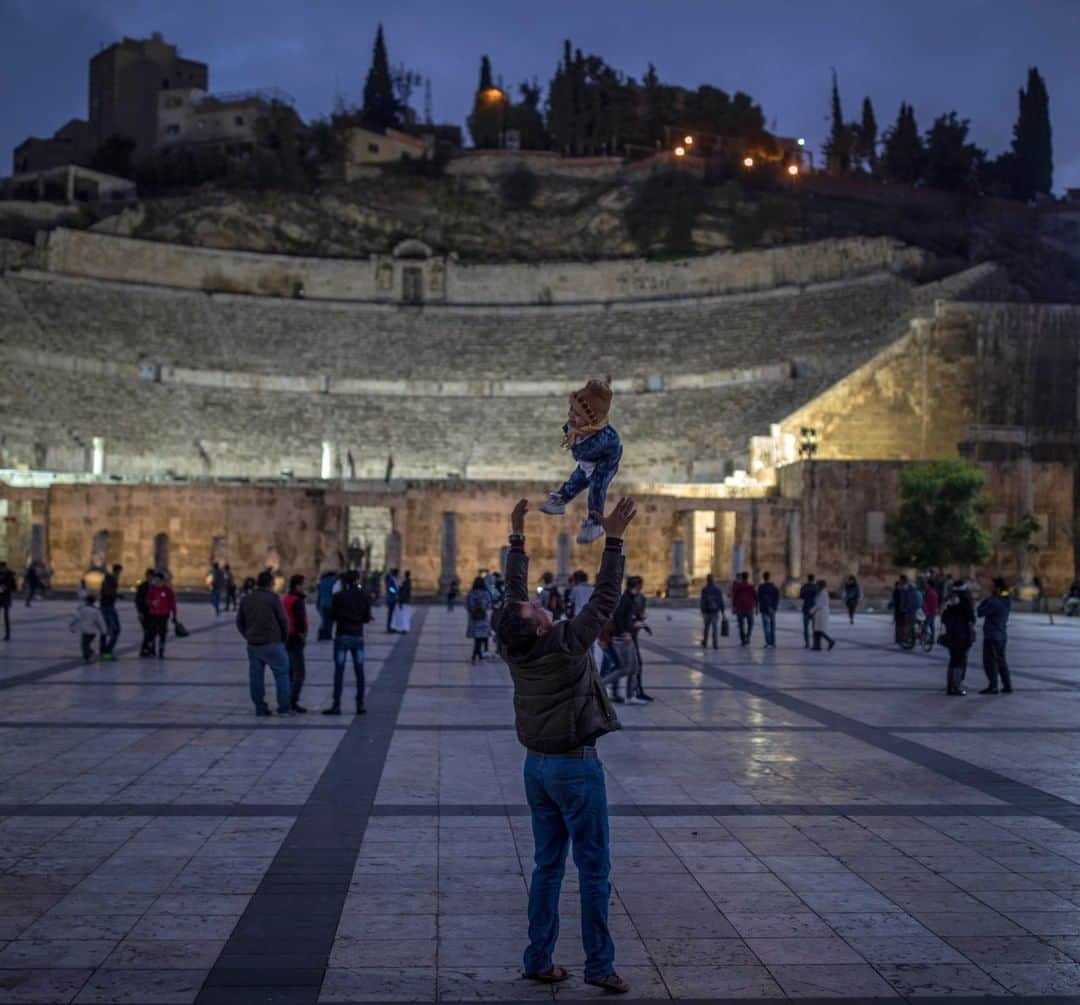 National Geographic Travelさんのインスタグラム写真 - (National Geographic TravelInstagram)「Photo by Muhammed Muheisen @mmuheisen | A father and son at the ancient Roman theater in Amman, Jordan. The 6,000-seat, second-century landmark dates back to when the city was known as Philadelphia. For more photos and videos from different parts of the world, follow me @mmuheisen and @mmuheisenpublic #muhammedmuheisen #Amman #الاردن」7月28日 16時03分 - natgeotravel