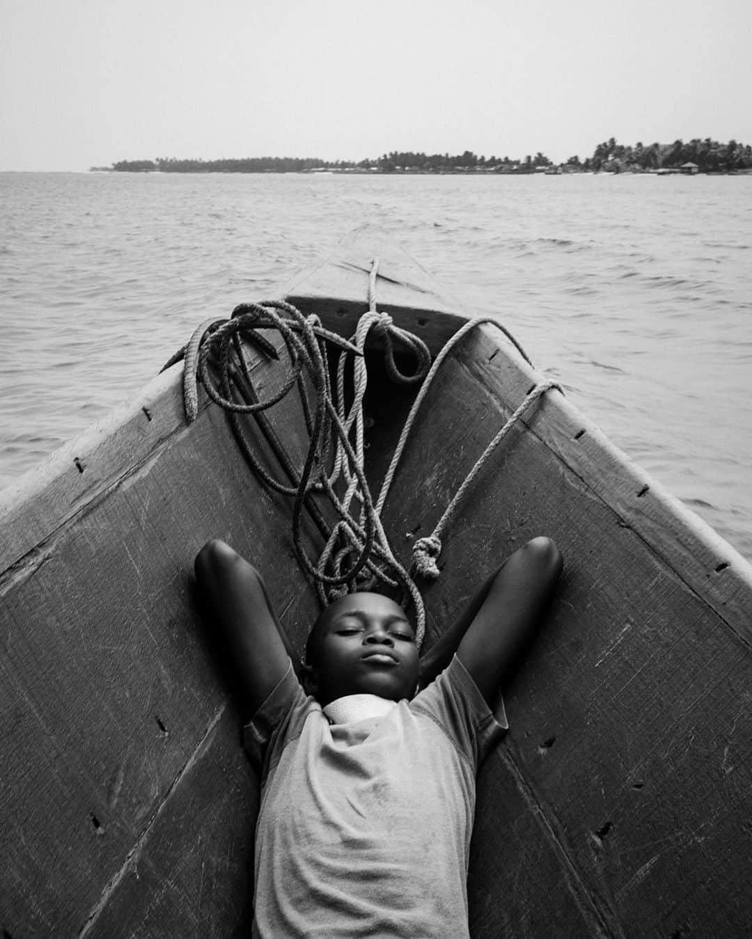 ライカさんのインスタグラム写真 - (ライカInstagram)「11-year-old Joseph takes a rest in his father's wooden canoe in Ghana. This water taxi carries locals commuting between the many small villages located on the Volta River estuary. This shot was captured with the Leica M-P by French photographer Antoine Jonquière (@antoine.jonquiere) and is part of his ongoing series "Sankofa", documenting the life of young Ghanaians. Find out more about the Leica M-P via the bio link.  #🔴📷 #LeicaM #LeicaMP #leica #leicacamera #leicaphotography #leicaphoto #leicagram #leica_world #leica_club #leicasociety #documentaryphotography #Ghana #VoltaRiver #travelphotography #burkinafaso #bnw_world #bnw_street #everydayafrica」7月28日 23時00分 - leica_camera