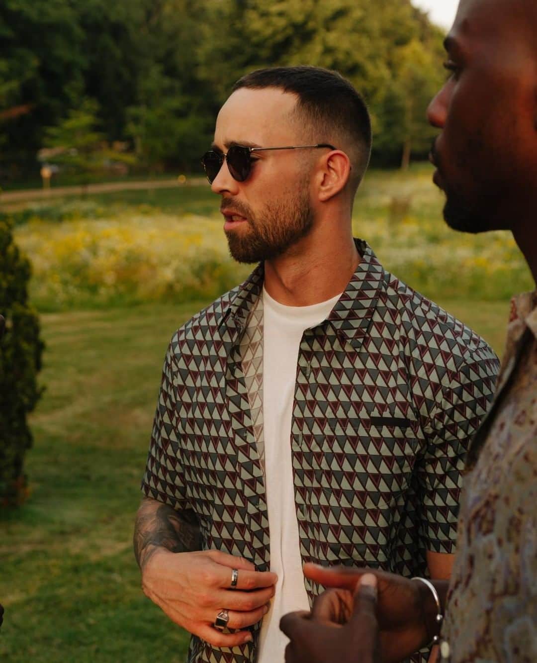 MR PORTERのインスタグラム：「A white tee and printed shirt = summer's most reliable uniform.⁠ -⁠ Mr @imdanielsimmons wearing @prada (1150692). Tap or head to the link in bio to shop. #MRPORTER」
