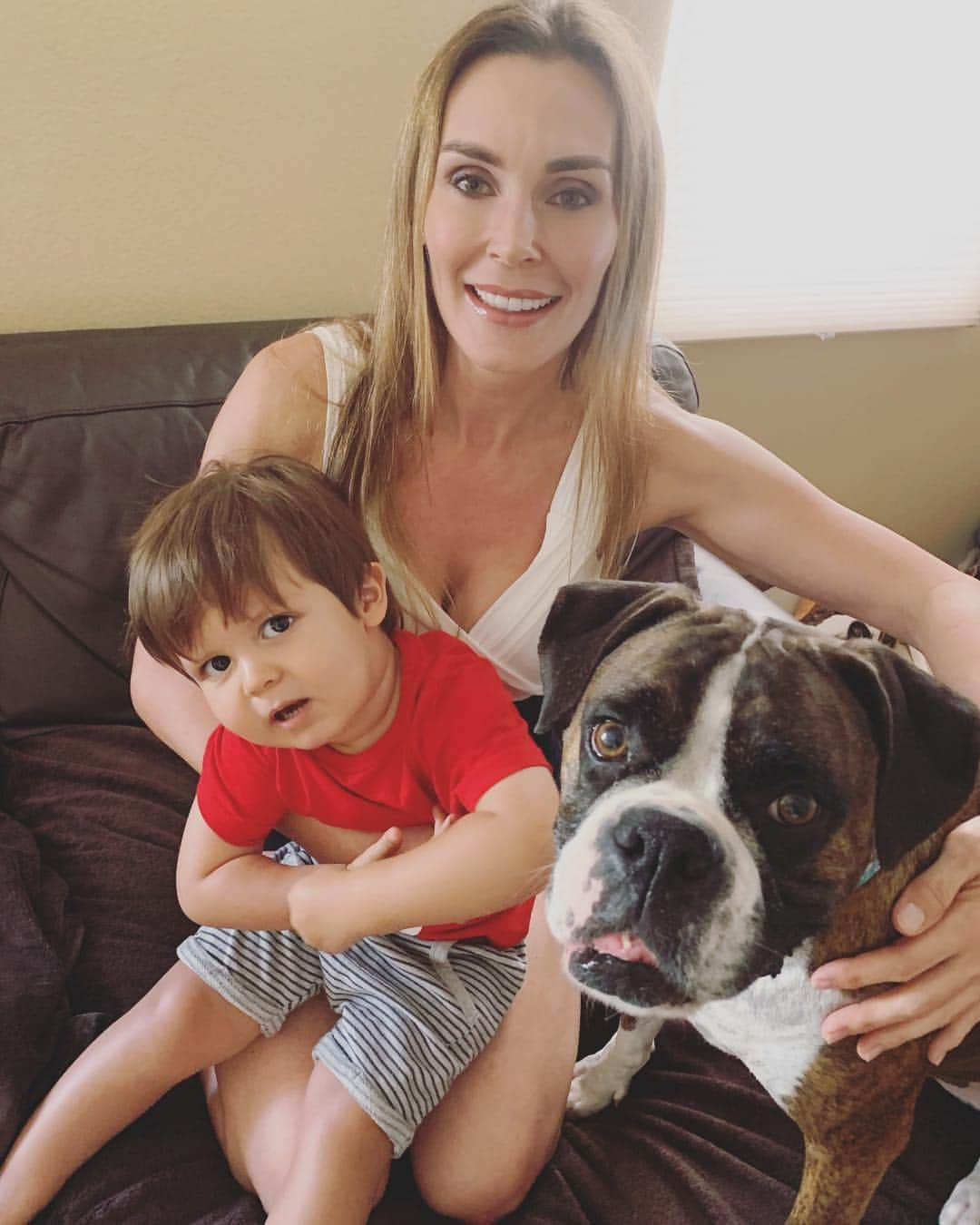 ターニャ・テイトさんのインスタグラム写真 - (ターニャ・テイトInstagram)「That face when you are saying hurry up and take the pic before everyone moves off the couch 😆 My son is called Oswald aka Ozzie and my boxer dog is called Millie. If I got another boxer dog and he was male I would call him Kojak. What are your favourite names?  #nationaldogday🐶 #nationaldogday #boxerdog #tanyatate #queentanyatate #myson #mydog」8月1日 3時05分 - tanyatate