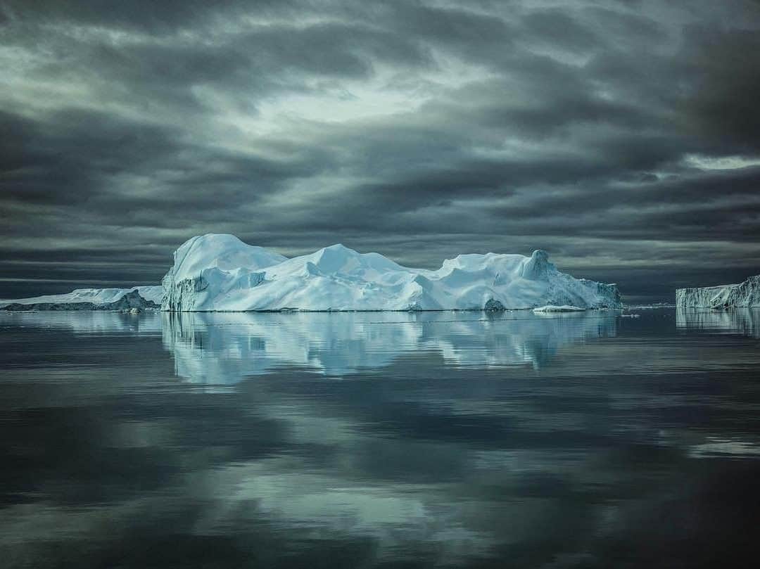 National Geographic Travelさんのインスタグラム写真 - (National Geographic TravelInstagram)「Photo by @jimmychin | Reflections. Surreal glassed off evening floating through the Ilulissat Icefjord. For more images from the west coast of Greenland, follow @jimmychin」8月1日 19時04分 - natgeotravel