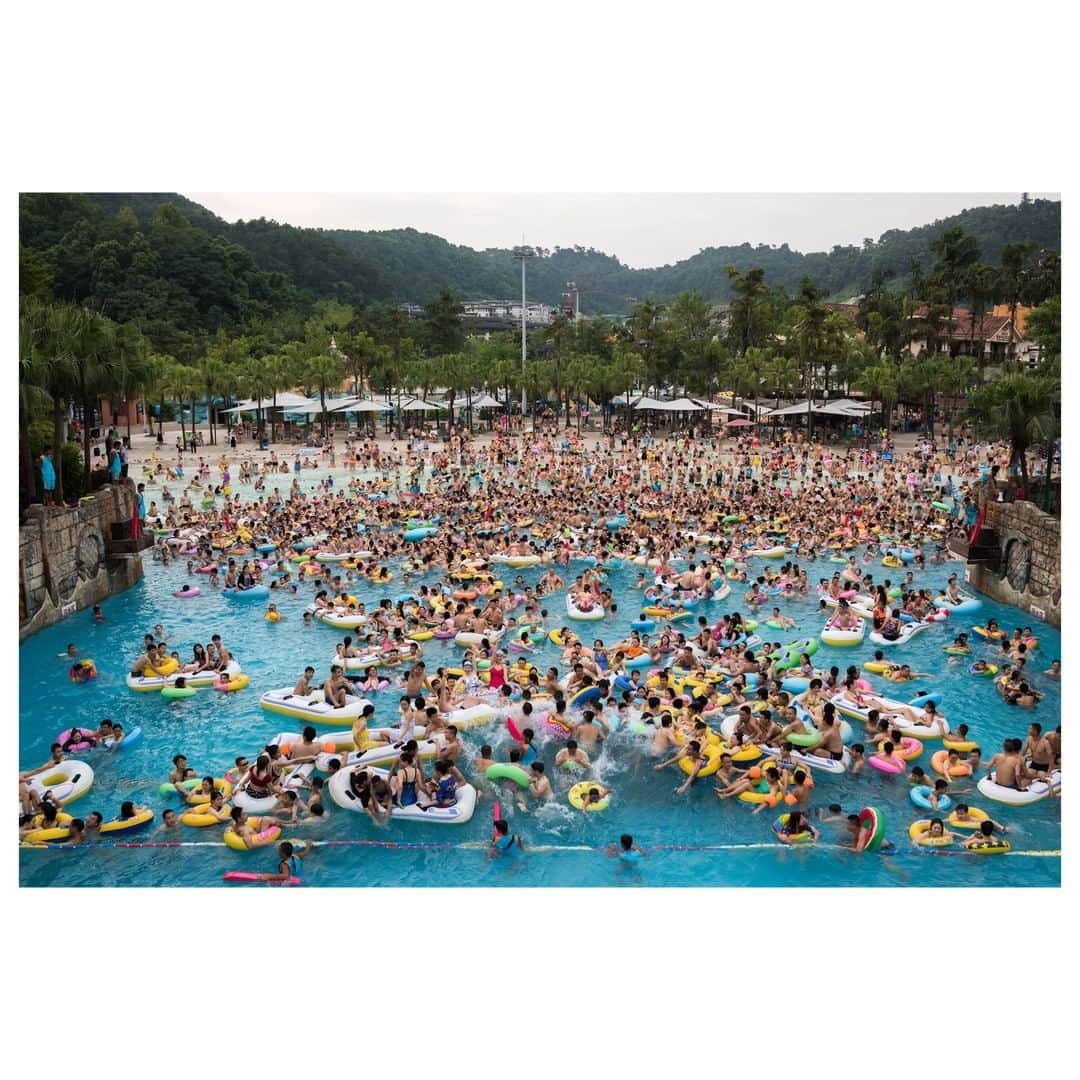 Magnum Photosさんのインスタグラム写真 - (Magnum PhotosInstagram)「"In some coastal cities like Qingdao and Hainan, swimming in the sea is something people do every morning. In other spots like Beijing and Chongqing which are land-locked, a trip to the pool or water-theme park is more like a day trip for the whole family during the summer." - @chiyin_sim . Today on Magnum: In the latest instalment of our summer series exploring how societies holiday, Magnum nominee @chiyin_sim shares her experiences documenting beach and pool culture in China. Link in bio. . PHOTO: Chinese vacationers from all walks of life pile into the wave pool at the Chongqing Caribbean Water Park during a heat wave at the height of summer. The almost-hourly sessions with waves generated mechanically are the most popular thing in the water park which can receive over 13,000 visitors in a single day on summer weekends. The waterpark is among China's most popular. The wave pool is a favourite of daytrippers in inland Chongqing who do not get to see or experience the sea much. The waterpark is built half way up the Nanshan mountain on the outskirts of Chongqing, a metropolis in China's southwest known for spicy food and - in recent years - political scandal. Chongqing, China. 2017. . © @chiyin_sim/#MagnumPhotos . #SimChiYin #China #Chongqing」8月2日 18時01分 - magnumphotos
