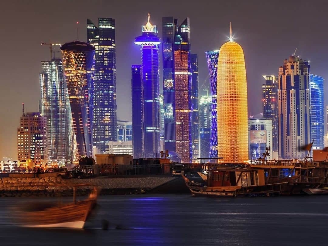 National Geographic Travelさんのインスタグラム写真 - (National Geographic TravelInstagram)「Photo by @BabakTafreshi | The skyline of Doha, Qatar, at the southern shore of the Persian Gulf. The mix of traditional culture and futuristic skyscrapers that have been raised in the past two decades is an interesting contrast. An old-looking fishing boat appears ghostly trailed in this time-exposure image, reminding me of the vanishing past in the sudden glare of future. Explore more of The World at Night photography with me @babaktafreshi. #doha #nightphotography #cities」8月4日 0時57分 - natgeotravel