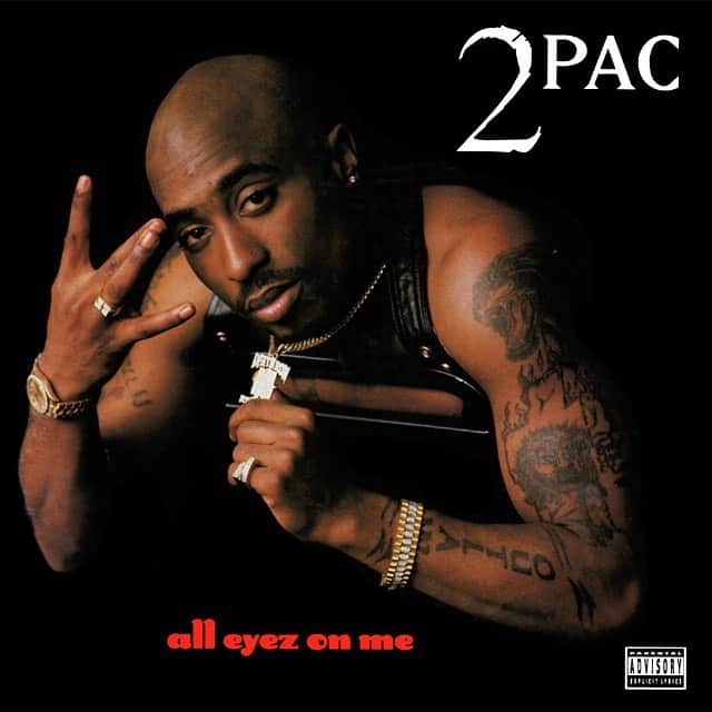 Juxtapoz Magazineさんのインスタグラム写真 - (Juxtapoz MagazineInstagram)「It’s tough to dissociate All Eyez on Me from the pre-streaming era, when an album felt like a friend you could unravel an afternoon with—or in the case of 2Pac’s 1996 magnum opus, an accomplice who’d help you steal your parents’ car in the middle of the night when you were 14. If you were patient, a record left you with a story that made you feel something.  The story of All Eyez on Me began on October 12, 1995. 2Pac, at the peak of his fame, had spent the better part of that year in prison for a sexual abuse conviction before selling his soul to Suge Knight, who, in exchange for a three-album, $3.5M deal with Death Row, posted 2Pac’s $1.4M bail. 2Pac created the entire double-disc album during a frantic 14-day period that began the same night he walked out of prison. The result? A 132-minute war cry directed at Biggie and Bad Boy; and an urgent portrait of a brilliant artist approaching the end of his short life. The album dropped in early 1996 and 2Pac was murdered that fall.  It’s hard to think of an image that better represents that man at that moment than that cover. Shot by Death Row photographer Ken Nahoum, 2Pac is shirtless except for the black leather strap of a Jean Paul Gaultier vest. His tattoos and jewelry on full display, he reps West Coast as he offers up his Death Row pendant to the camera like a cat delivering a hummingbird to its owner’s doorstep. He stares into the camera with defiance. All eyes are on him—and he knows it. But beneath the swagger lies a soulfulness that reminds you of his complexity as an artist, and a human: He was a Black Panther’s son who beefed with C. Dolores Tucker; a poet who penned the most vitriolic dis track of all time; an author of feminist anthems who was convicted of sexual abuse.  That the face of one of the most defining moments in West Coast rap history was an art school kid from Harlem is particularly ironic, but fitting. 2pac remains a contradictory, polarizing and mesmerizing figure—the kind of artist who makes the kind of music, that, 23 years later, inspires rappers and soundtracks joyrides in the burbs. — @elizabethsuman #juxtapozsoundandvision」8月5日 7時44分 - juxtapozmag