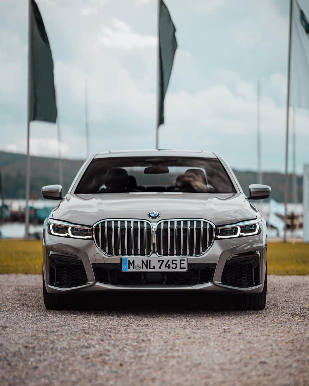 BMWのインスタグラム：「The perfect synthesis of luxury and innovation. The BMW 7 Series Sedan at the Bayerischer Yacht Club. #THE7 #BMW #7Series @bmw_yachtsport __ BMW 745e Sedan: Energy consumption in kWh/100 km (combined): 15.5-15.1. Fuel consumption in l/100 km (combined): 2.2-2.1. CO2 emissions in g/km (combined): 51-48. The values of fuel consumptions, CO2 emissions and energy consumptions shown were determined according to the European Regulation (EC) 715/2007 in the version applicable at the time of type approval. The figures refer to a vehicle with basic configuration in Germany and the range shown considers optional equipment and the different size of wheels and tires available on the selected model. The values of the vehicles are already based on the new WLTP regulation and are translated back into NEDC-equivalent values in order to ensure the comparison between the vehicles. [With respect to these vehicles, for vehicle related taxes or other duties based (at least inter alia) on CO2-emissions the CO2 values may differ to the values stated here.] The CO2 efficiency specifications are determined according to Directive 1999/94/EC and the European Regulation in its current version applicable. The values shown are based on the fuel consumption, CO2 values and energy consumptions according to the NEDC cycle for the classification. For further information about the official fuel consumption and the specific CO2 emission of new passenger cars can be taken out of the „handbook of fuel consumption, the CO2 emission and power consumption of new passenger cars“, which is available at all selling points and at https://www.dat.de/angebote/verlagsprodukte/leitfaden-kraftstoffverbrauch.html.」
