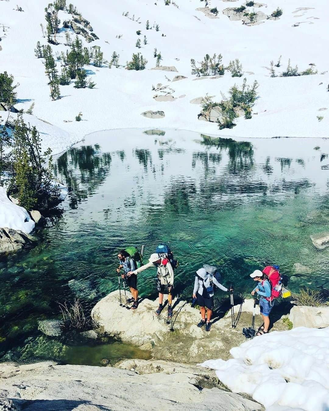 REIさんのインスタグラム写真 - (REIInstagram)「"[PCT] Mile 792 | Team Water Crossing on the north side of Glen Pass: The stretch of trail between Bishop and Mammoth Lakes has been the most challenging hiking yet. Cold and wet 2:00 AM wake up calls combined with 15 hour hiking days felt daunting at first. "During the first few days I began to doubt myself and questioned if I belonged in The Sierra. It was mostly the river crossings that got in my head. Despite being a strong swimmer, my weight and height were no match to the strength and fury of The Sierra’s rapids in one of the highest snow years on record. "These thoughts quickly faded as other hikers insisted on helping those that were smaller and not as strong in the rivers by carrying packs, linking arms, and testing routes. "I’ve found most thru hikers have a fundamental sense of independence. To fly across the country or world and show up at a trailhead knowing no one—there is a sense of owning one's survival and not needing to depend on others. If the Sierra has taught me one thing, it’s the importance of depending on others and accepting help graciously. For me it’s become clear the sum of the whole is so much greater than the sum of its parts. "Interestingly enough, out of our Sierra group of seven hikers—just two are American. The rest representing Switzerland, The Netherlands, England, France, and Germany. As it turns out—community, selflessness, and caring for others transcends cultures and boundaries. "Forever thankful for the humans that helped me over the crossings which allowed me to continue on this adventure." Photo: @sarahhmoss in Kings Canyon National Park, #California. #OptOutside」8月5日 23時00分 - rei