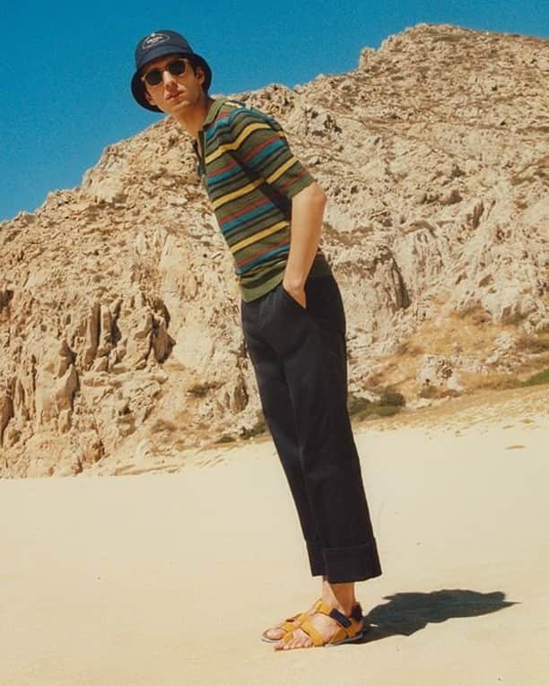 MR PORTERのインスタグラム：「⁠Summer slacks: a study.⁠ -⁣⁠ 🛒 Jacquemus Polo Shirt (1110558), Dries Van Noten Trousers (1105473), Dries Van Noten Sandals (1105354), Prada Bucket Hat (1116565), Moscot Sunglasses (1133041) and Bunney Bracelet (1127165) available now via the link in bio. #MRPORTER」