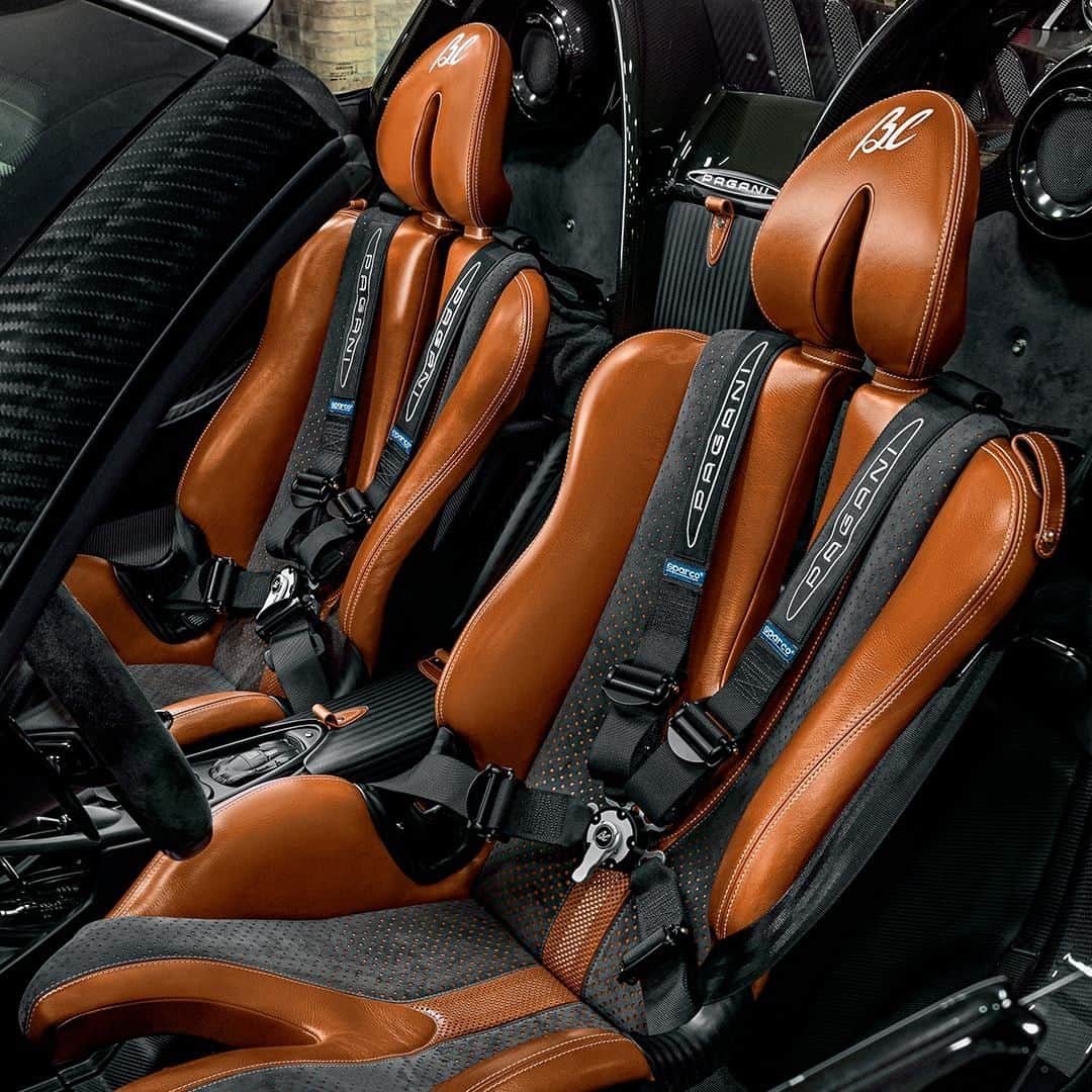 パガーニ・アウトモビリのインスタグラム：「Elegance and style are transmitted by materials like the carbo-wood and finely embossed leather, as well as by mechanisms such as the racing style, four-point seatbelt and sophisticated accessories like the nine-channel audio system.  #discoveringbc #interiors #pagani #huayra #roadsterbc」