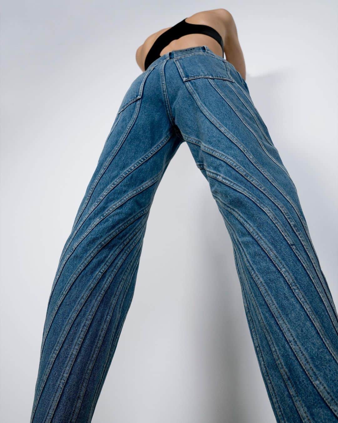 のインスタグラム：「High waisted spiral jeans available @brownsfashion. - - Visuals @studio.m.antwerp  #mugler」