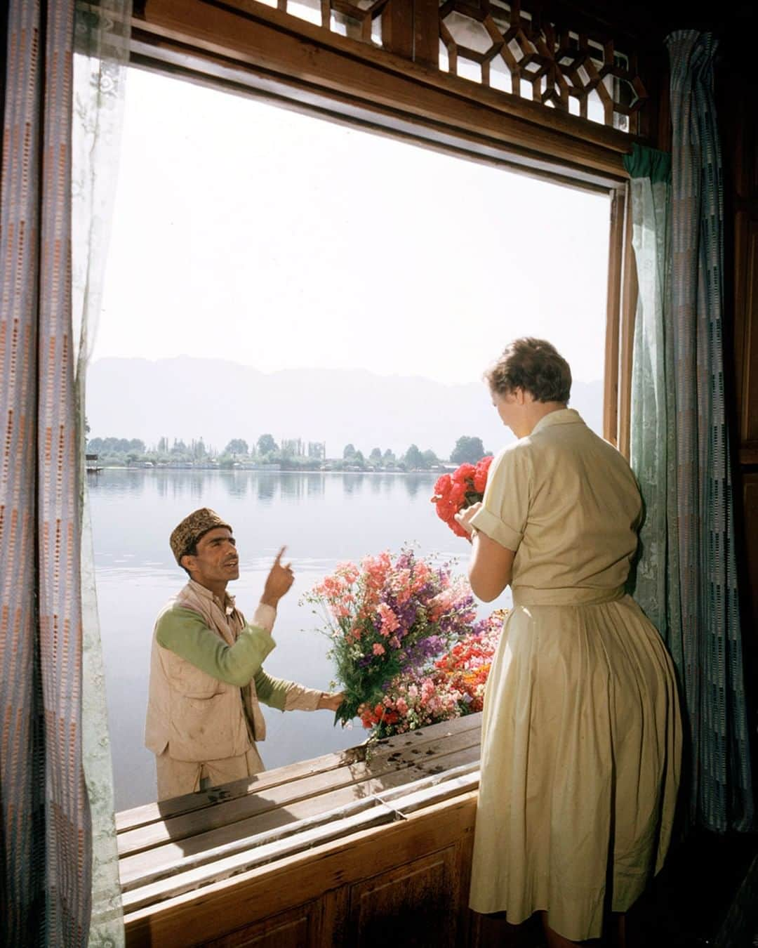 lifeさんのインスタグラム写真 - (lifeInstagram)「55 years ago this week from the August 14, 1964 TRAVEL feature: "VACATION IN A FABLED VALE." A similar image opened the story with the following caption: "A floating flower ship glides up to a houseboat on a lake in the Vale of Kashmir, and Carol Thomas from Kalamazoo, Mich. picks out blossoms for the breakfast table. For Americans today, even the fabled far-off Vale can be a travel stop. On these pages LIFE inaugurates its new Travel Department which will take people to places they want to go—or will want to go after they have heard more about them." (James Burke—The LIFE Picture Collection/Getty Images) #thisweekinLIFE #Kashmir」8月12日 22時27分 - life