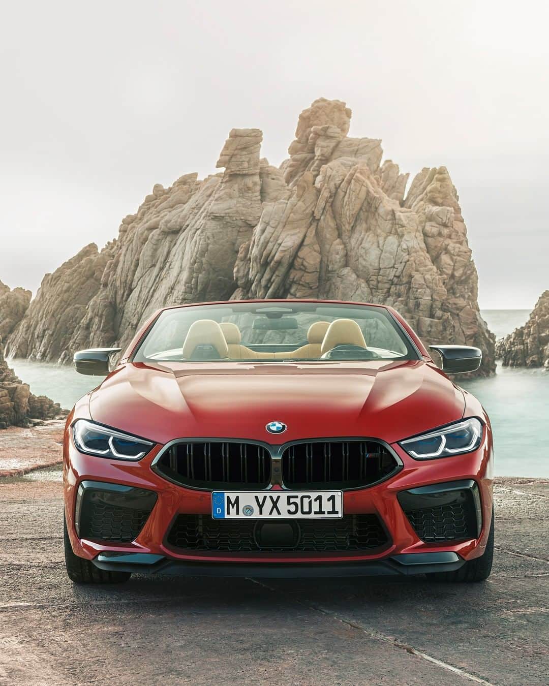 BMWのインスタグラム：「High peak of elegance. The first-ever BMW M8 Competition Convertible. #TheM8 #BMW #M8 #BMWM __ BMW M8 Competition Convertible: Fuel consumption in l/100 km (combined): 10.8. CO2 emissions in g/km (combined): 246.  Power: 460 kW, 625 hp, 750 Nm. Top speed (limited): 250 km/h (with optional M Drivers Package: 305 km/h). Paint finish shown: Motegi Red metallic.  The values of fuel consumptions, CO2 emissions and energy consumptions shown were determined according to the European Regulation (EC) 715/2007 in the version applicable at the time of type approval. The figures refer to a vehicle with basic configuration in Germany and the range shown considers optional equipment and the different size of wheels and tires available on the selected model. The values of the vehicles are already based on the new WLTP regulation and are translated back into NEDC-equivalent values in order to ensure the comparison between the vehicles. [With respect to these vehicles, for vehicle related taxes or other duties based (at least inter alia) on CO2-emissions the CO2 values may differ to the values stated here.] The CO2 efficiency specifications are determined according to Directive 1999/94/EC and the European Regulation in its current version applicable. The values shown are based on the fuel consumption, CO2 values and energy consumptions according to the NEDC cycle for the classification. Further information on official fuel consumption figures and specific CO2 emission values of new passenger cars is included in the following guideline: 'Leitfaden über den Kraftstoffverbrauch, die CO2-Emissionen und den Stromverbrauch neuer Personenkraftwagen' (Guide to the fuel economy, CO2 emissions and electric power consumption of new passenger cars), which can be obtained free of charge from all dealerships, from Deutsche Automobil Treuhand GmbH (DAT), Hellmuth-Hirth-Str. 1, 73760 Ostfildern-Scharnhausen and at https://www.dat.de/co2/.」