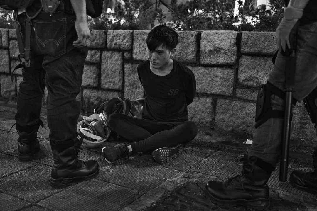 TIME Magazineさんのインスタグラム写真 - (TIME MagazineInstagram)「It has been a long, volatile summer in #HongKong, where anti-government #protests are well into their third month with no clear end in sight. Stakes are ratcheted higher each week as police and protesters face off amid thick clouds of tear gas and flying debris. The movement against a bill that would have allowed the extradition of fugitives to the mainland awakened deeper anxieties about the city’s future under Beijing’s authoritarian rule, developing into a broader fight to defend the freedoms that distinguish Hong Kong from the rest of #China. In this photograph, an antigovernment protester is arrested near the Tsim Sha Tsui police station in Kowloon on Aug. 11. See more pictures at the link in bio. Photograph by @adamfergusonstudio for TIME」8月16日 11時35分 - time