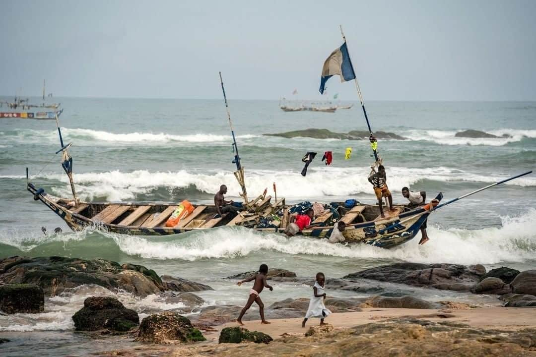 National Geographic Travelさんのインスタグラム写真 - (National Geographic TravelInstagram)「Photo by @cristinamittermeier | I was ready to drop my cameras and spring to the rescue as I watched fishermen fight to keep their boat upright as they approached the shore of the historic fishing town of Winneba, Ghana. Thankfully my heroics were not needed, but despite the incredible amount of effort they put into today’s haul, they will not have great economic reward. The odds are stacked against them because there is no means to preserve their catch. What isn’t sold at the local markets is thrown away or sold at a very low cost, placing struggling families under even more economic strain and at risk of selling their children into slavery under the false promise of a better life. Follow me @cristinamittermeier for more stories about people living in coastal communities all over the world. #Ghana #fishermen #community #sailboat」8月16日 19時01分 - natgeotravel